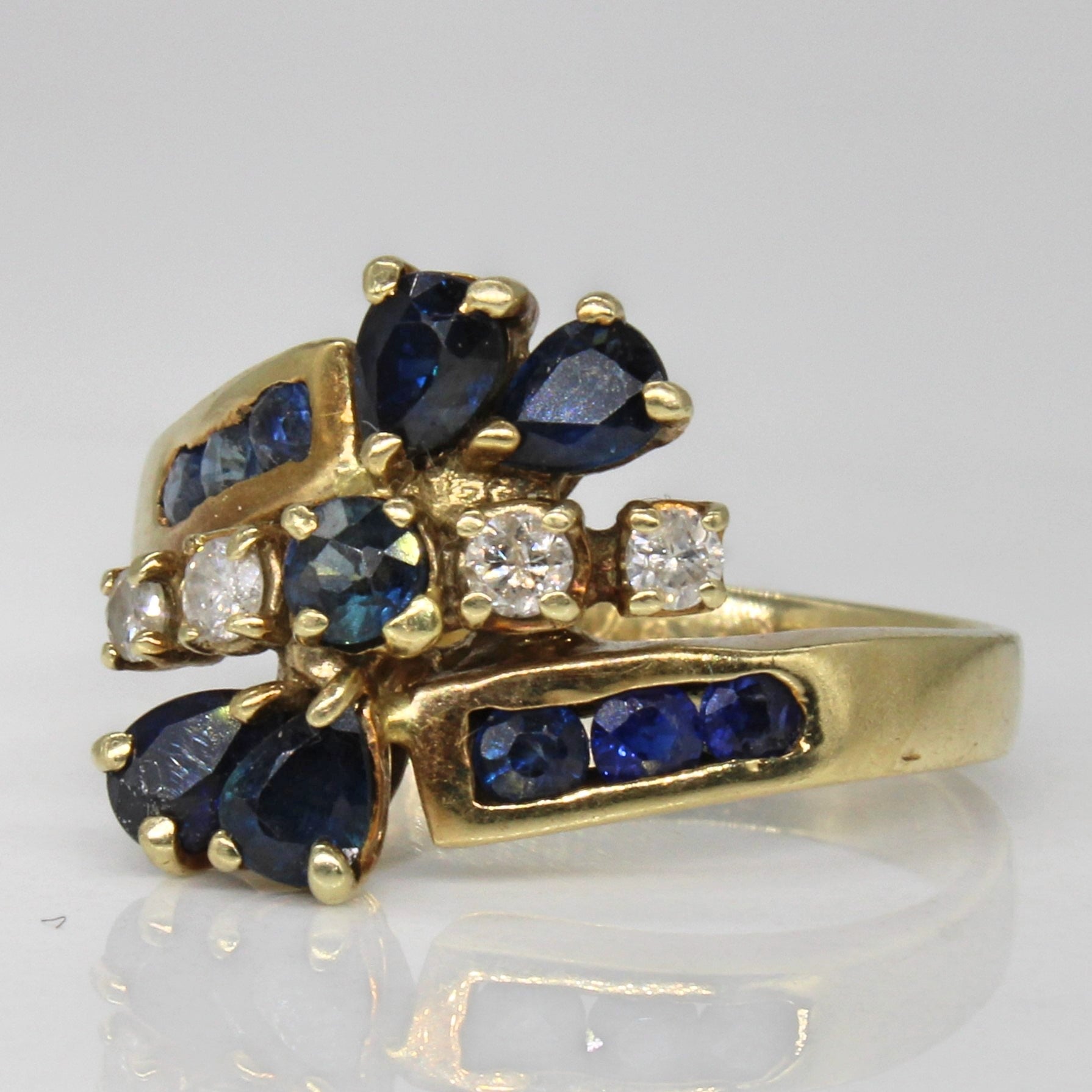 Unique Sapphire & Diamond Bypass Ring | 0.72ctw, 0.12ctw | SZ 8 |