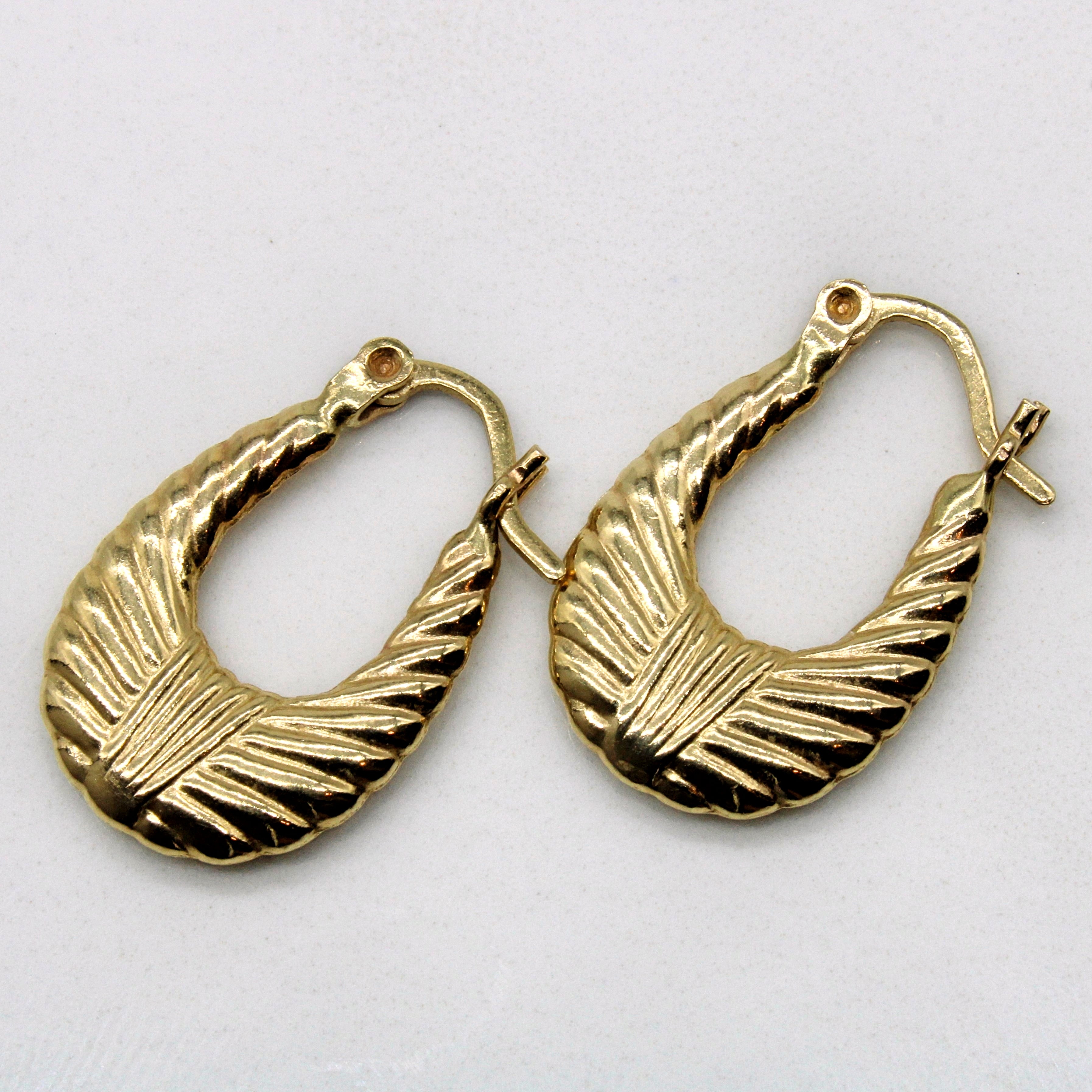 Boucles d'oreilles créoles ovales texturées |