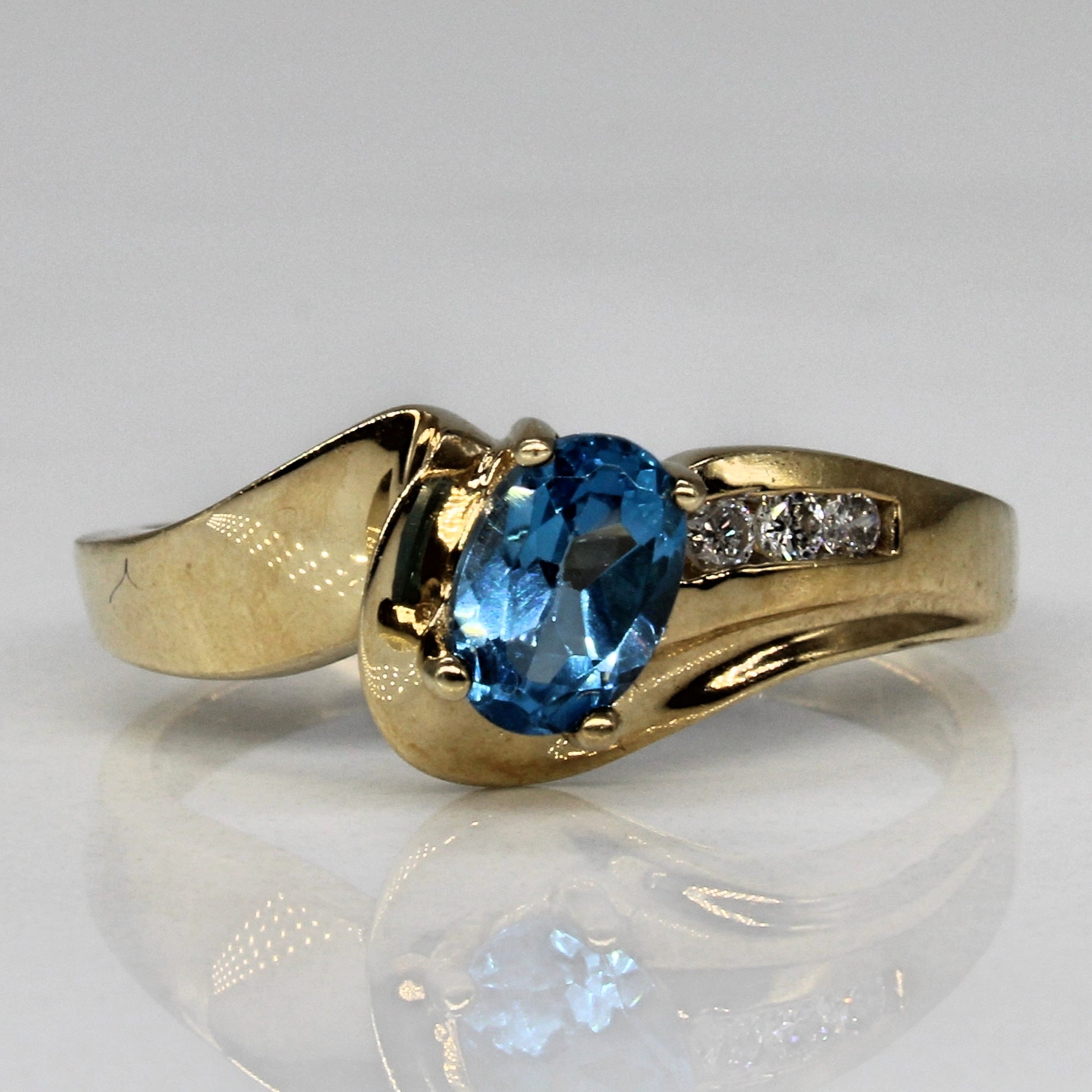 Blue Topaz & Diamond Bypass Ring | 0.55ct, 0.03ctw | SZ 6.75 |