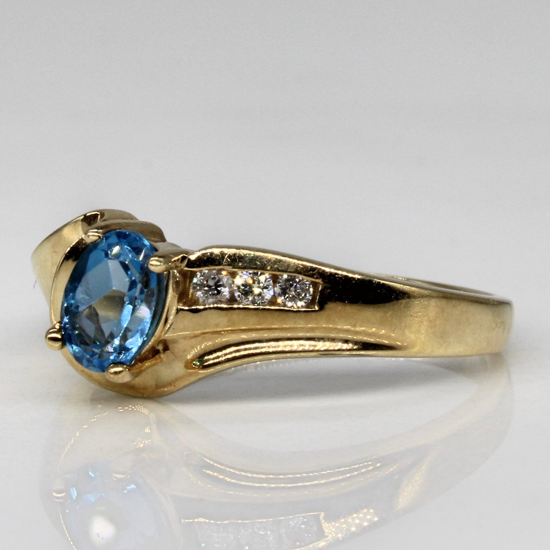 Blue Topaz & Diamond Bypass Ring | 0.55ct, 0.03ctw | SZ 6.75 |