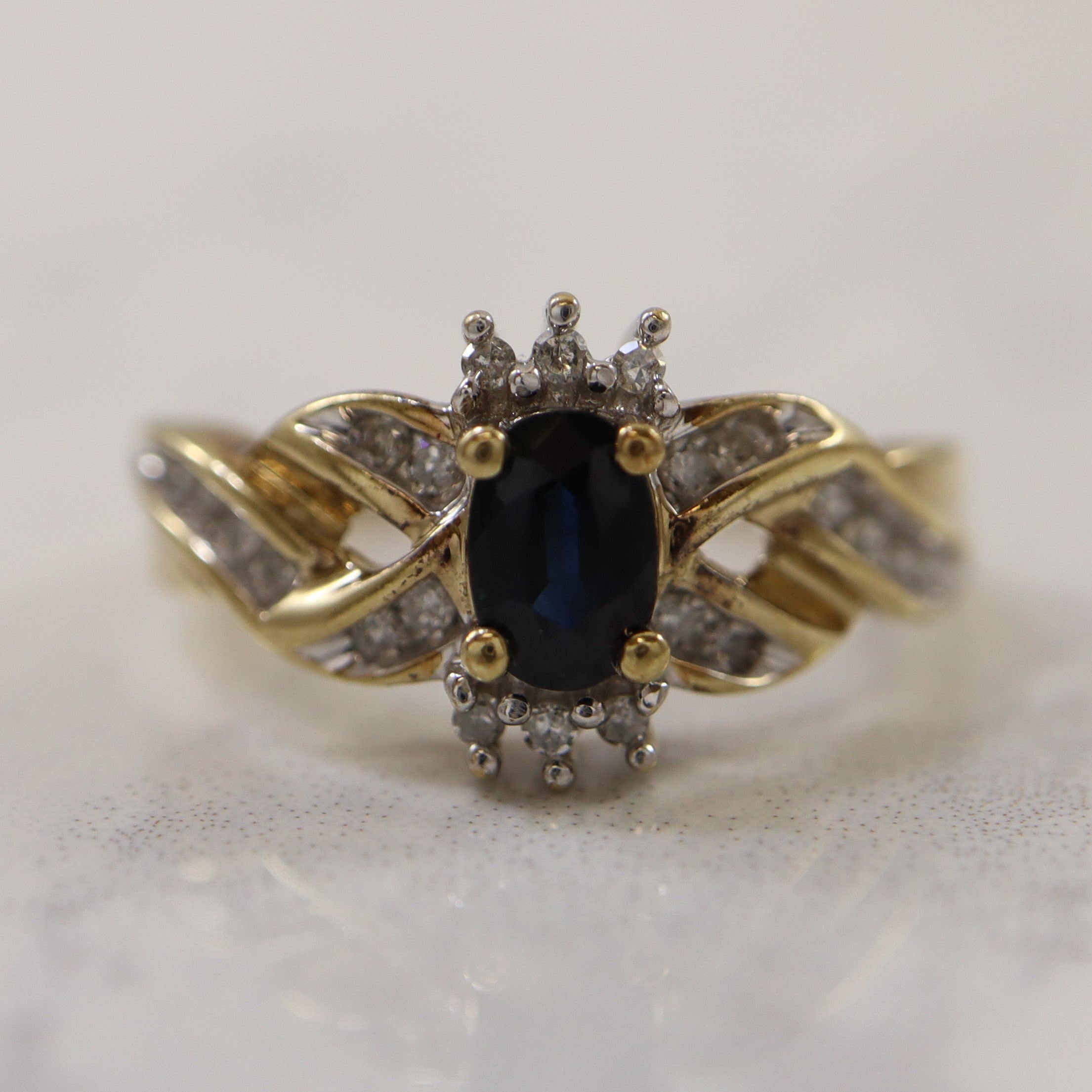 Sapphire & Diamond Crossover Ring | 0.60ct, 0.12ctw | SZ 7.25 |