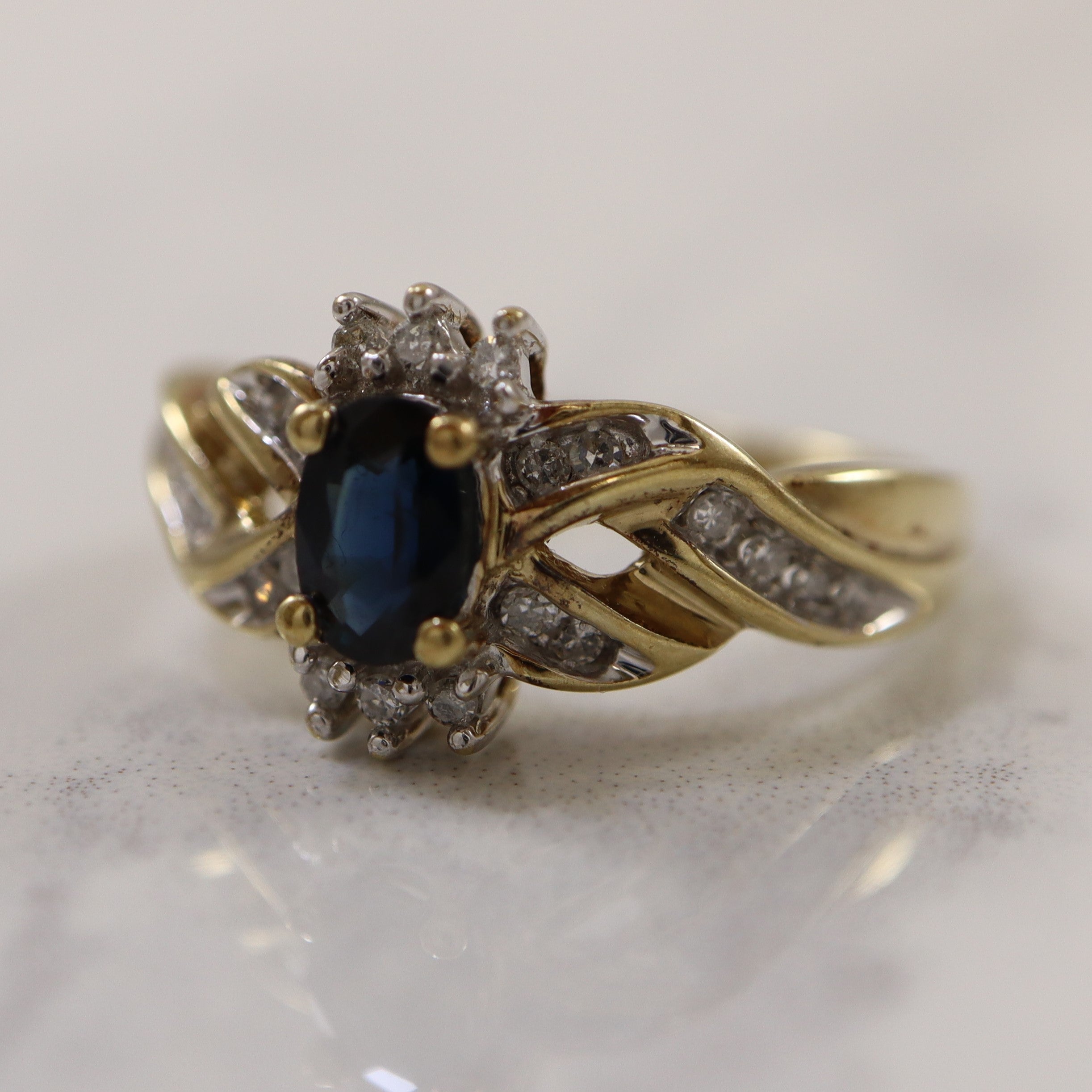 Sapphire & Diamond Crossover Ring | 0.60ct, 0.12ctw | SZ 7.25 |