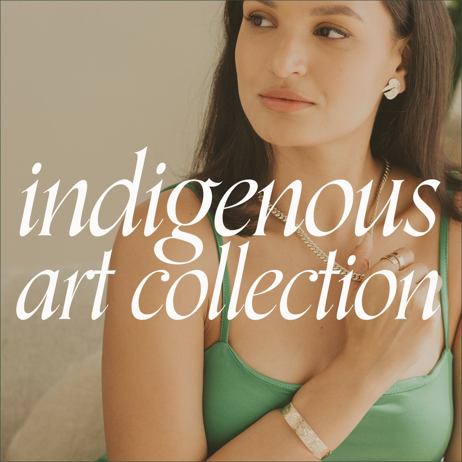 Close-up of a woman wearing earrings and ring with indigenous art motifs. Text overlay reads 'indigenous art collection'