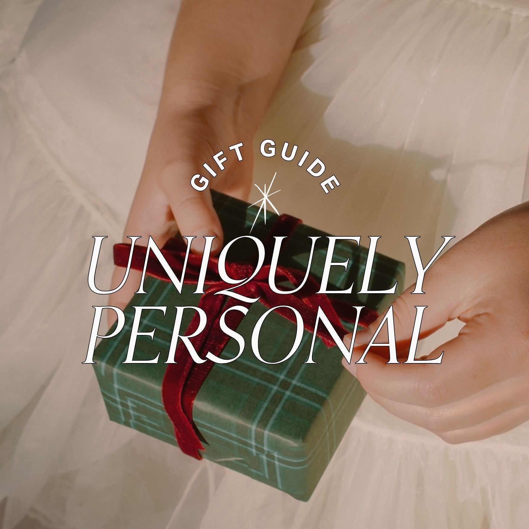 girl holding a plaid wrapped gift box with red velvet ribbon, text over reads gift guide: uniquely personal