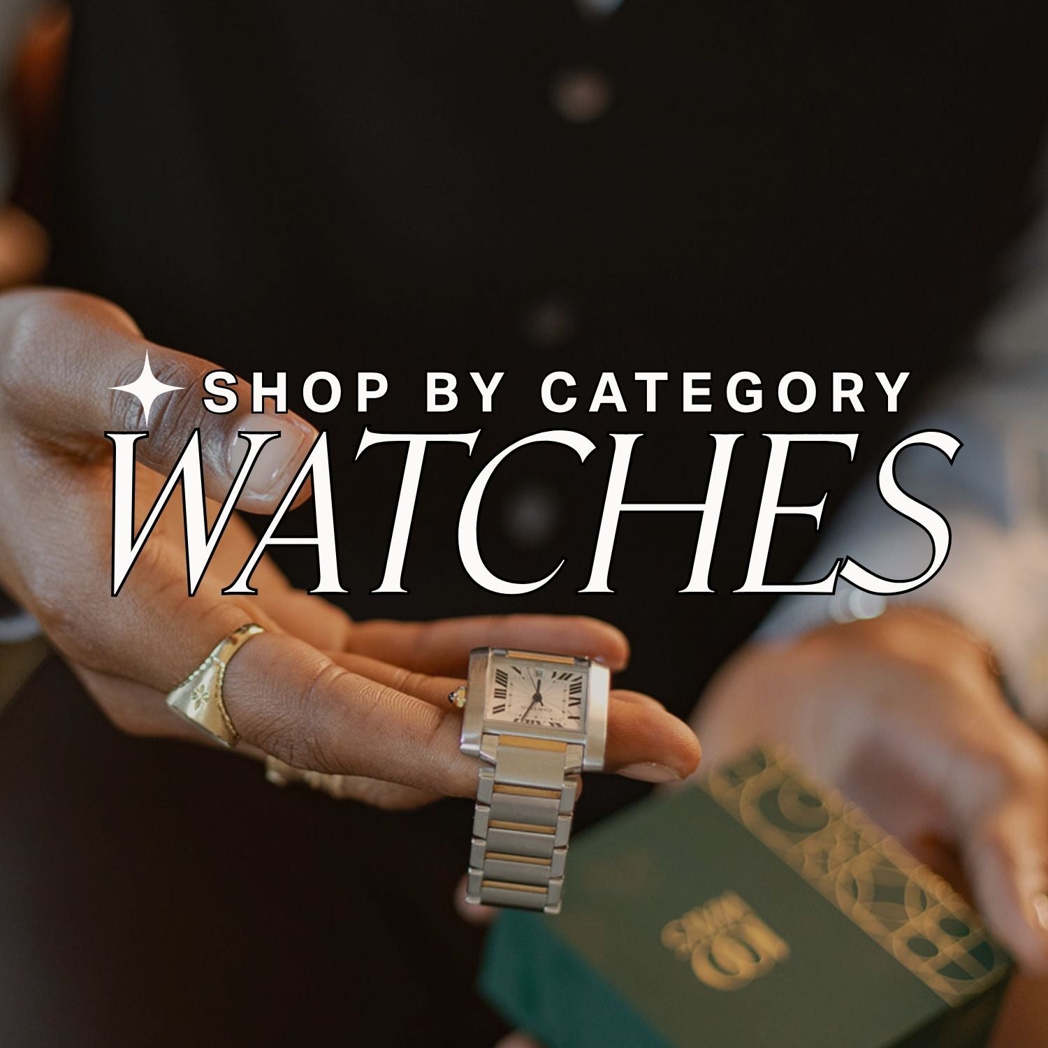 Hand holding a silver watch with blurred background, Text over reads: shop by category: watches