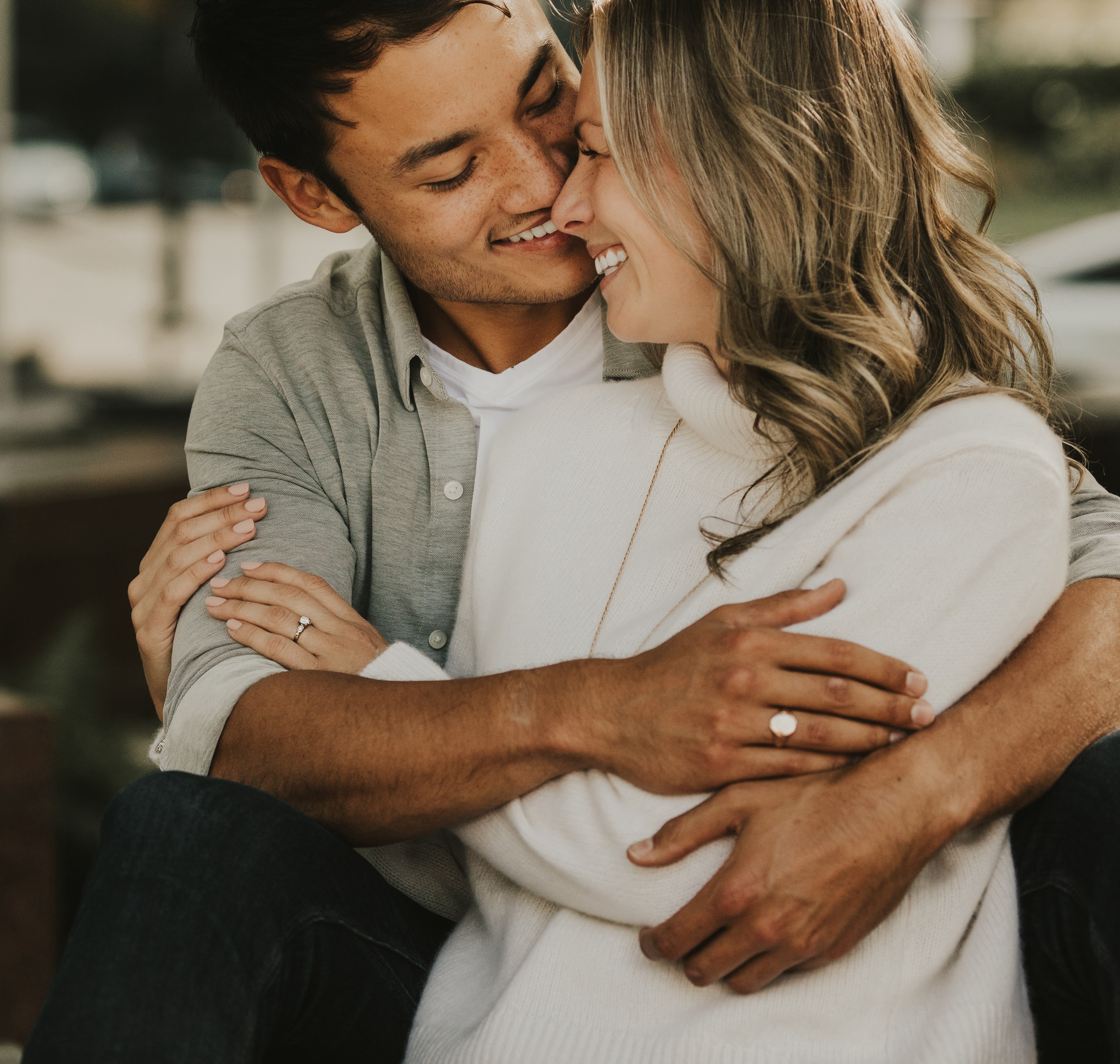 Image of couple embracing after proposal for jewelry company ad