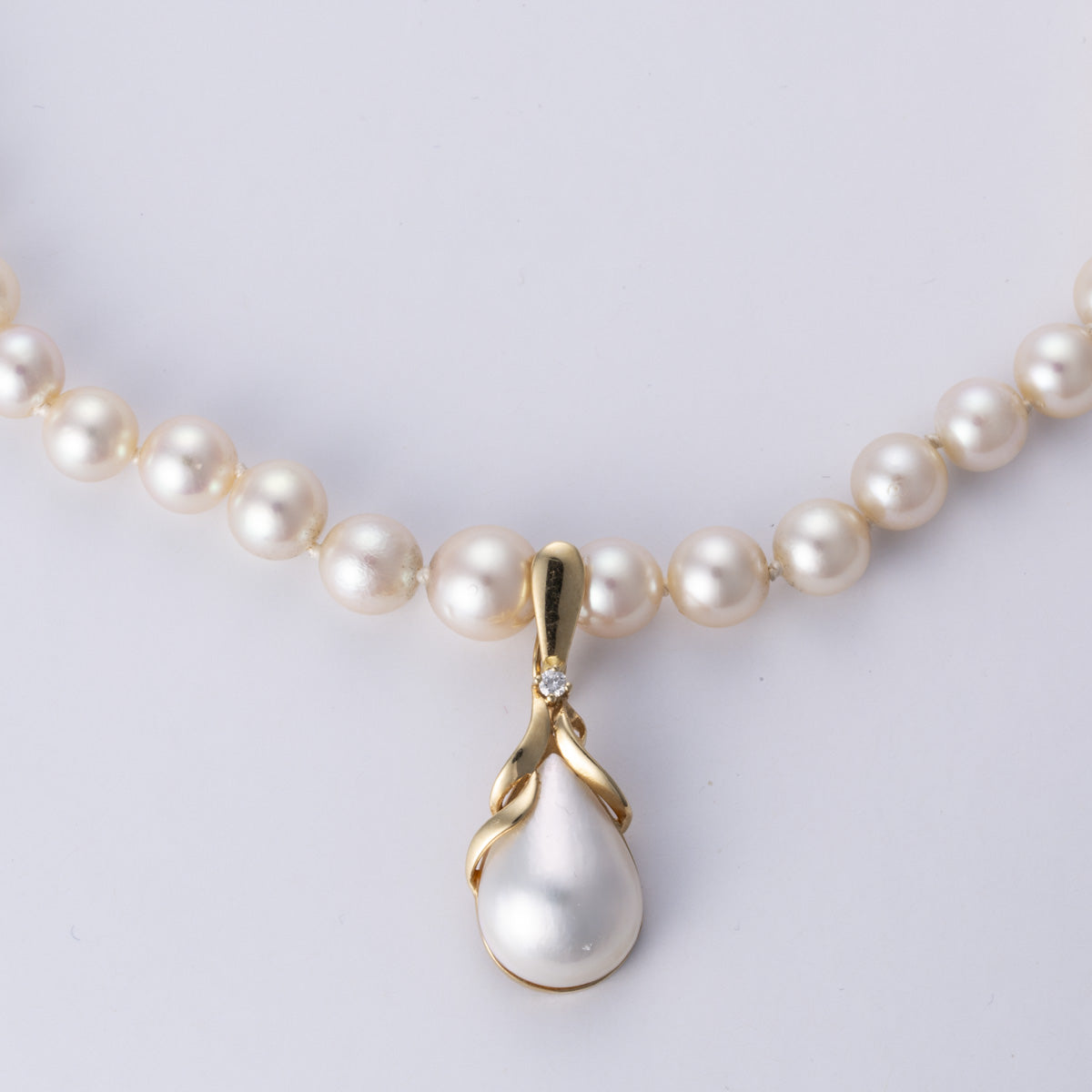 Collier en or jaune 14 carats, perle et diamant | 0,04 ct | 49,5 cm 