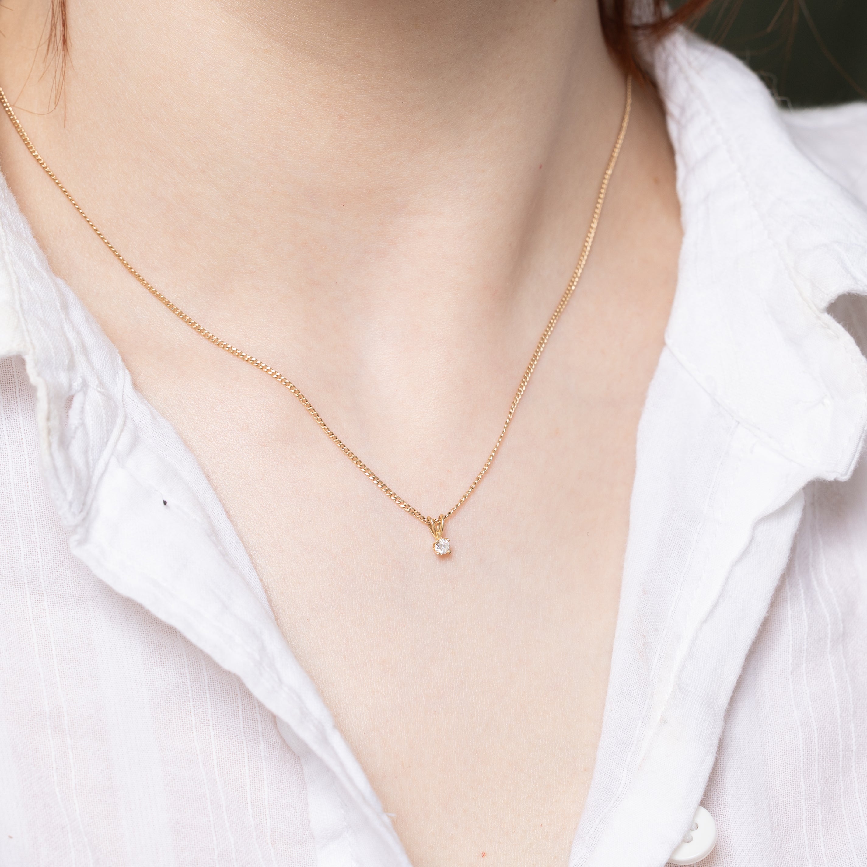 Pendentif en or jaune 14 carats serti de diamants