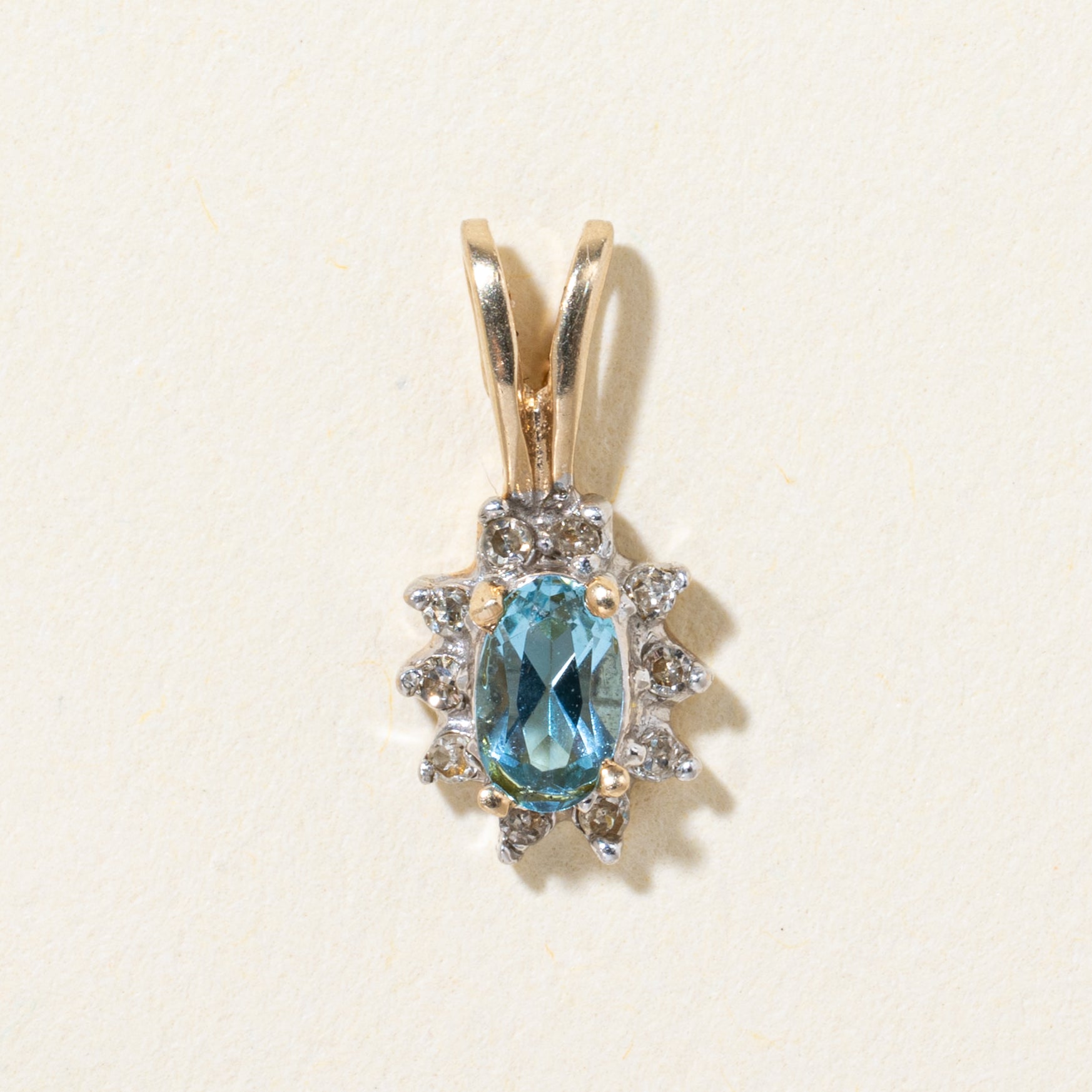 10k Blue Topaz & Diamond Halo Pendant