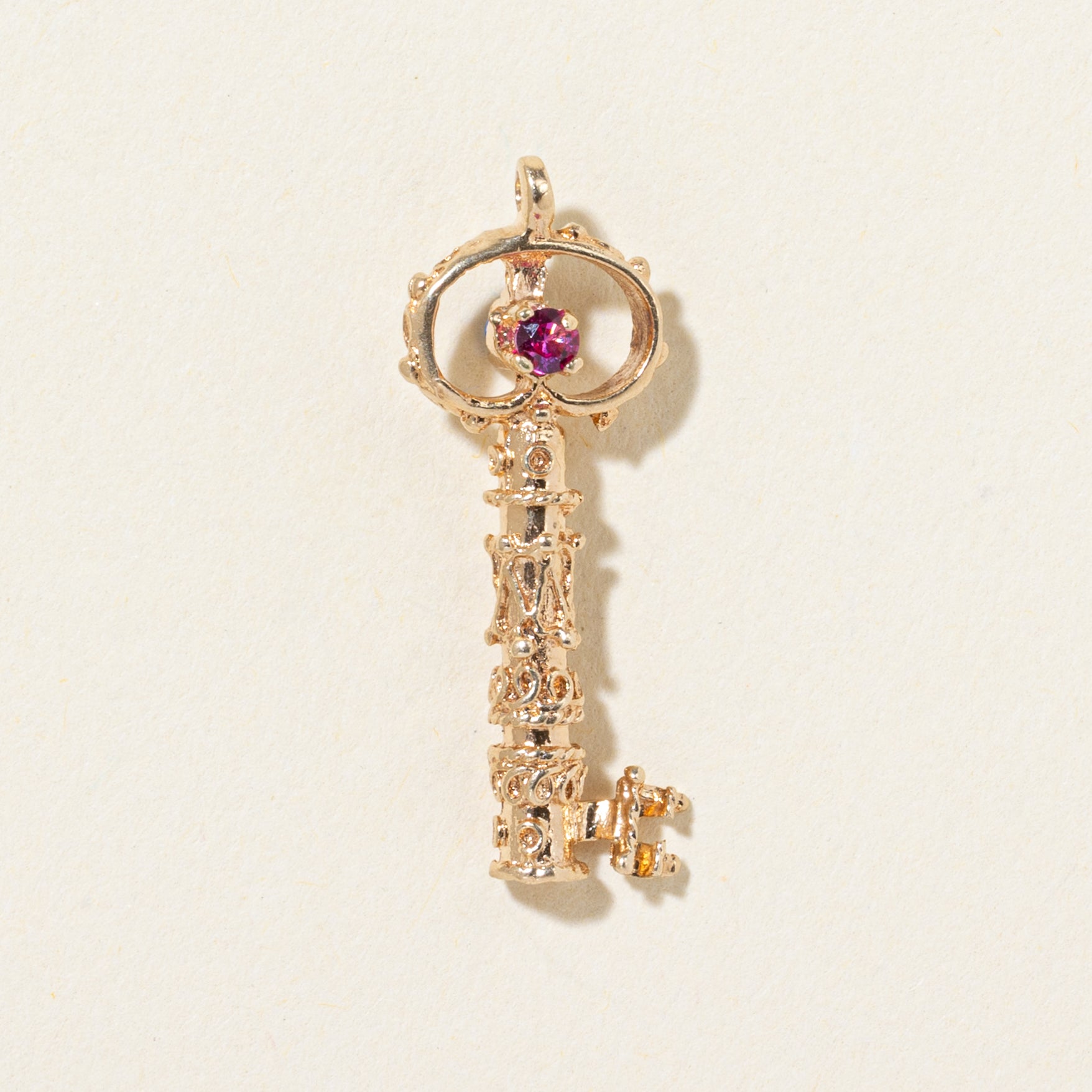 14k Synthetic Spinel Textured Key Pendant | 0.036ctw
