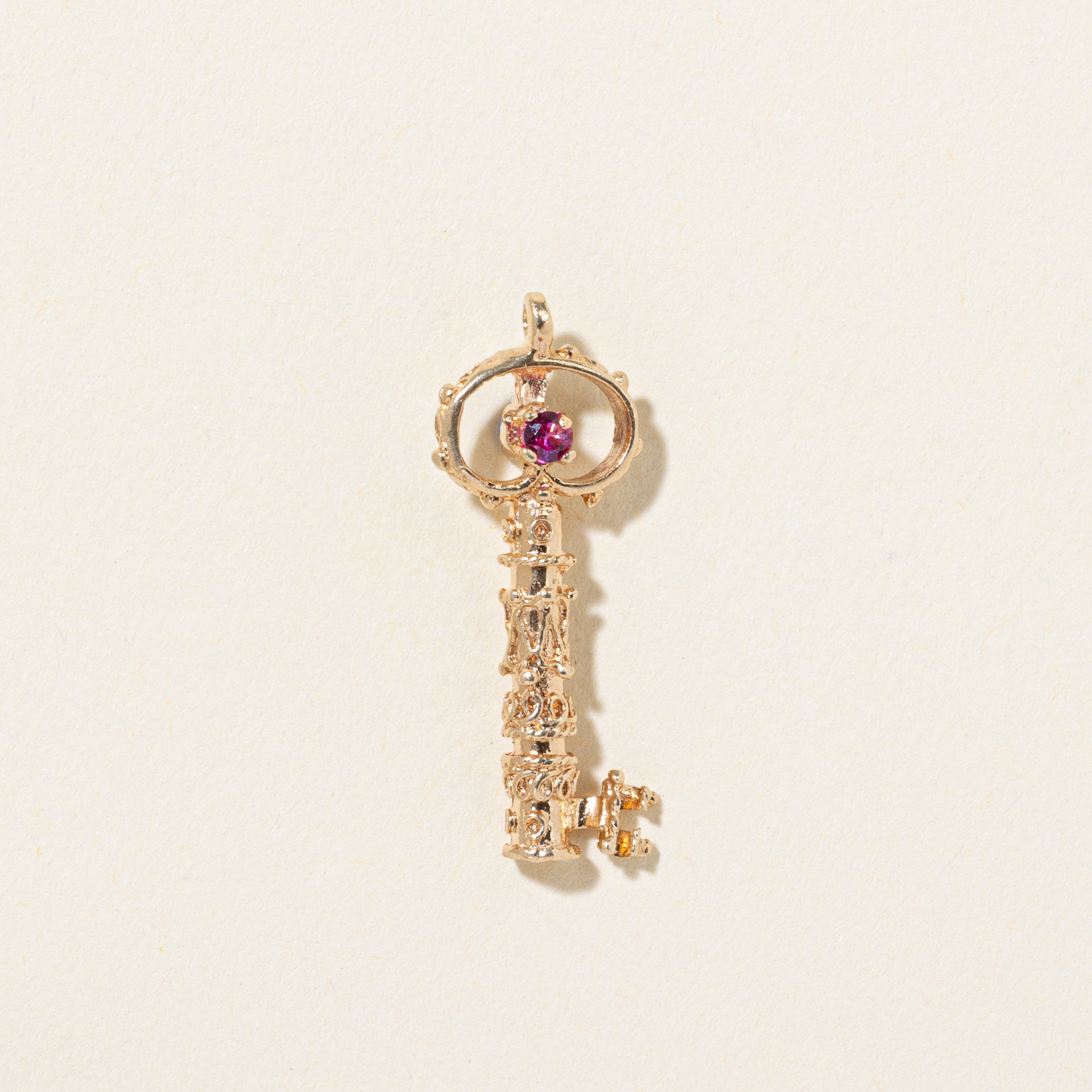 14k Synthetic Spinel Textured Key Pendant | 0.036ctw