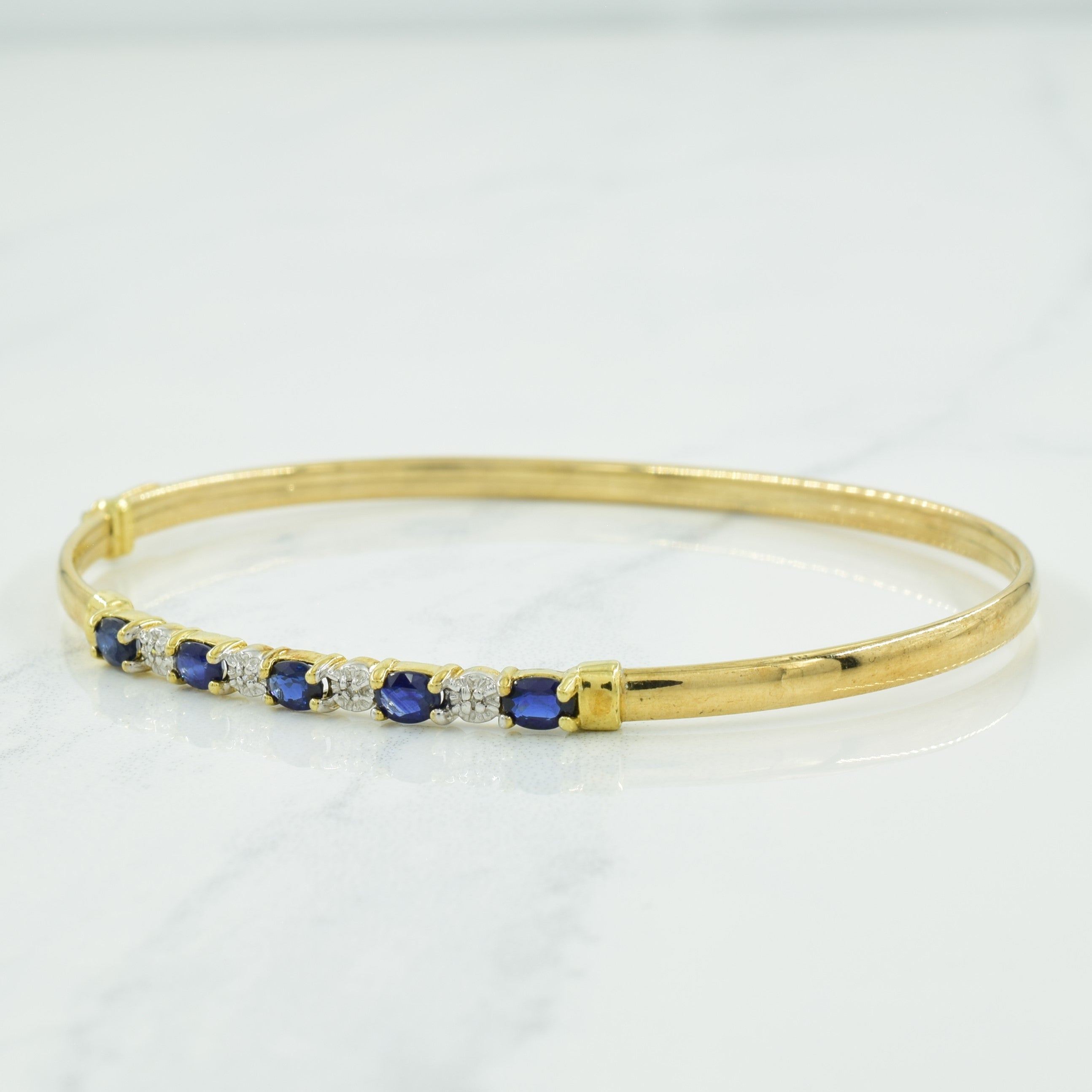 Bracelet en or jaune 10 carats, saphirs bleus et diamants | 0,90 ct, 0,02 ct | 7,5" | 