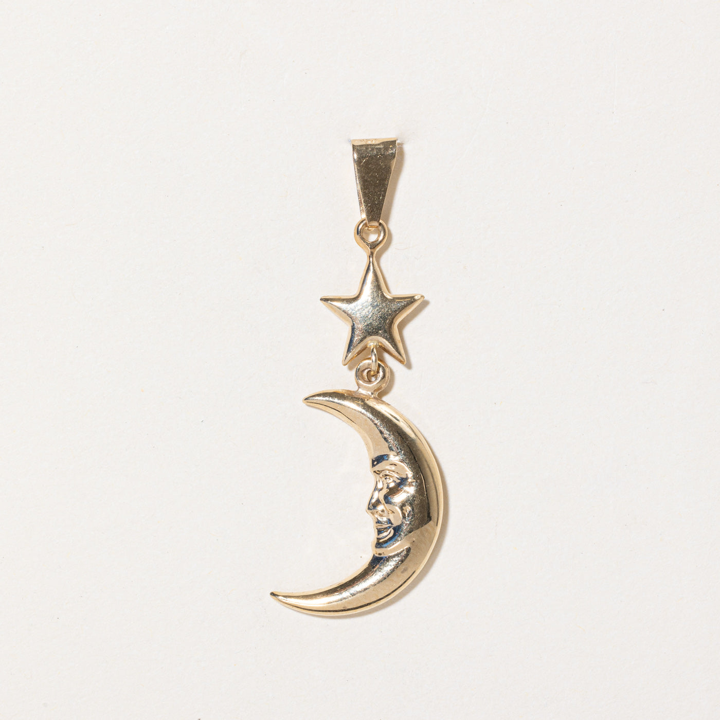 Pendentif lune et étoile en or jaune 14 carats
