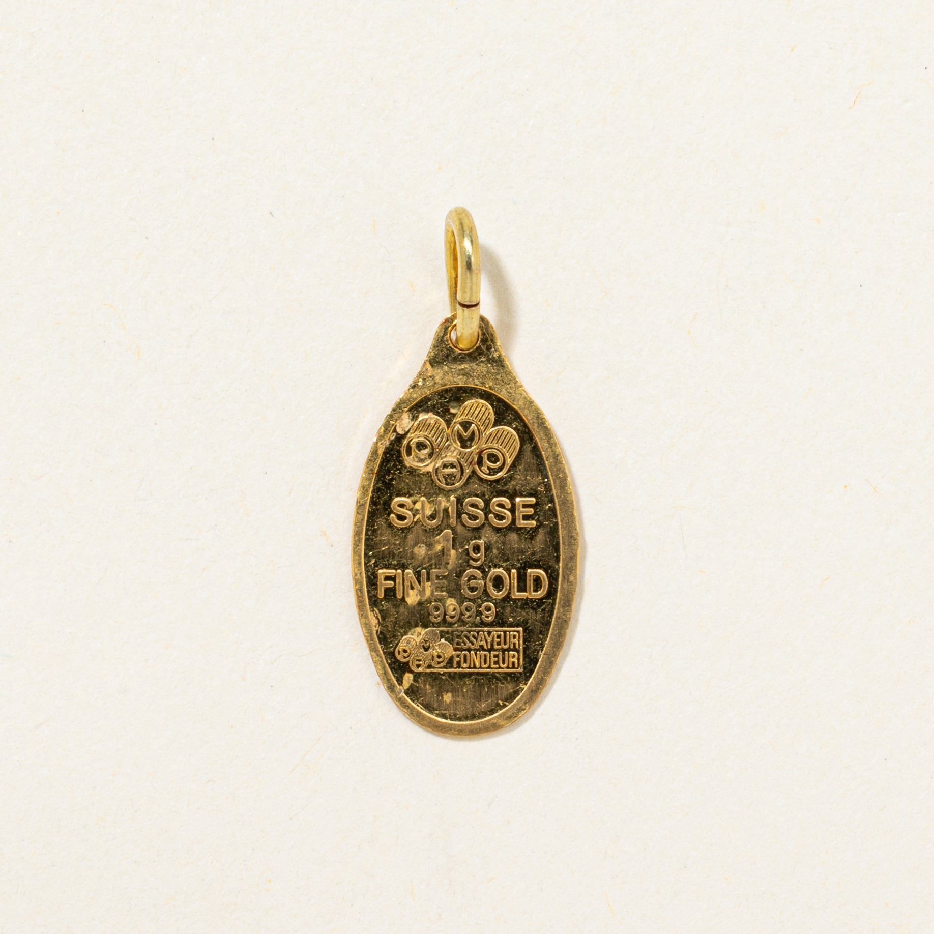 Breloque suisse en or jaune 24 carats (1 gramme)