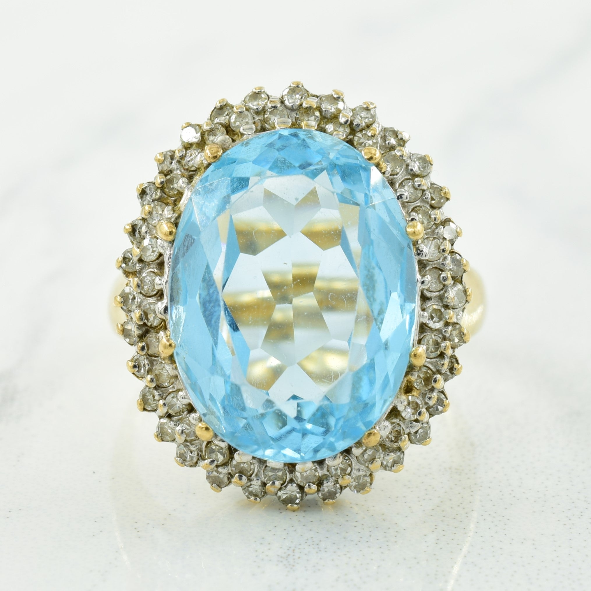 Blue Topaz & Diamond Halo Ring | 12.00ct, 0.32ctw | SZ 7 |
