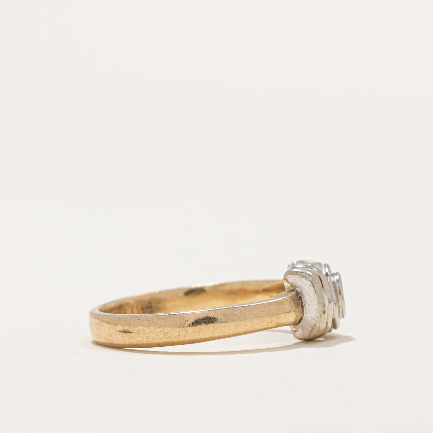 Bague en or bicolore sertie d'un diamant | 0,04 ct | Taille 4,5 | 