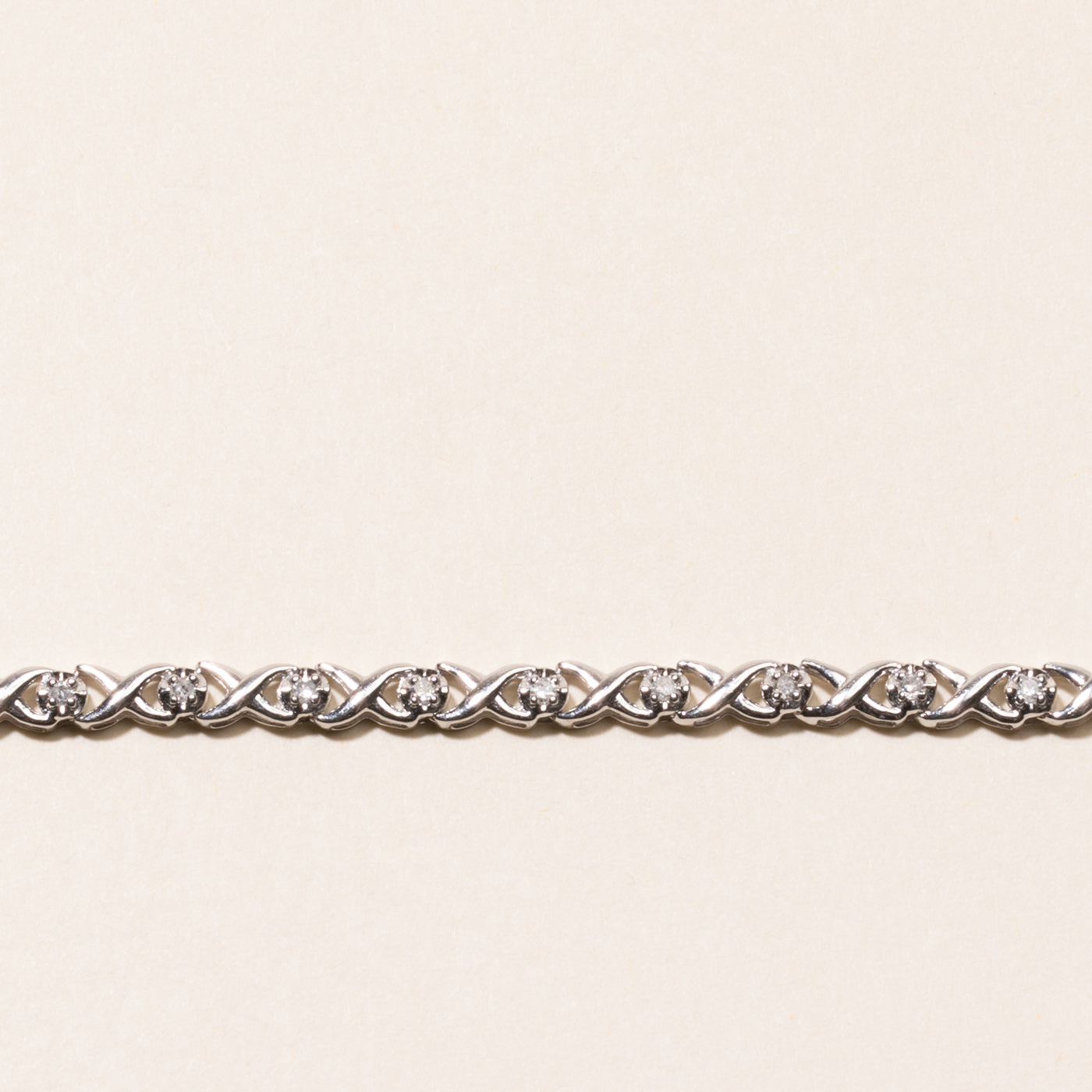 White Gold Illusion Set Diamond X Tennis Bracelet | 0.25ctw | 7.25"