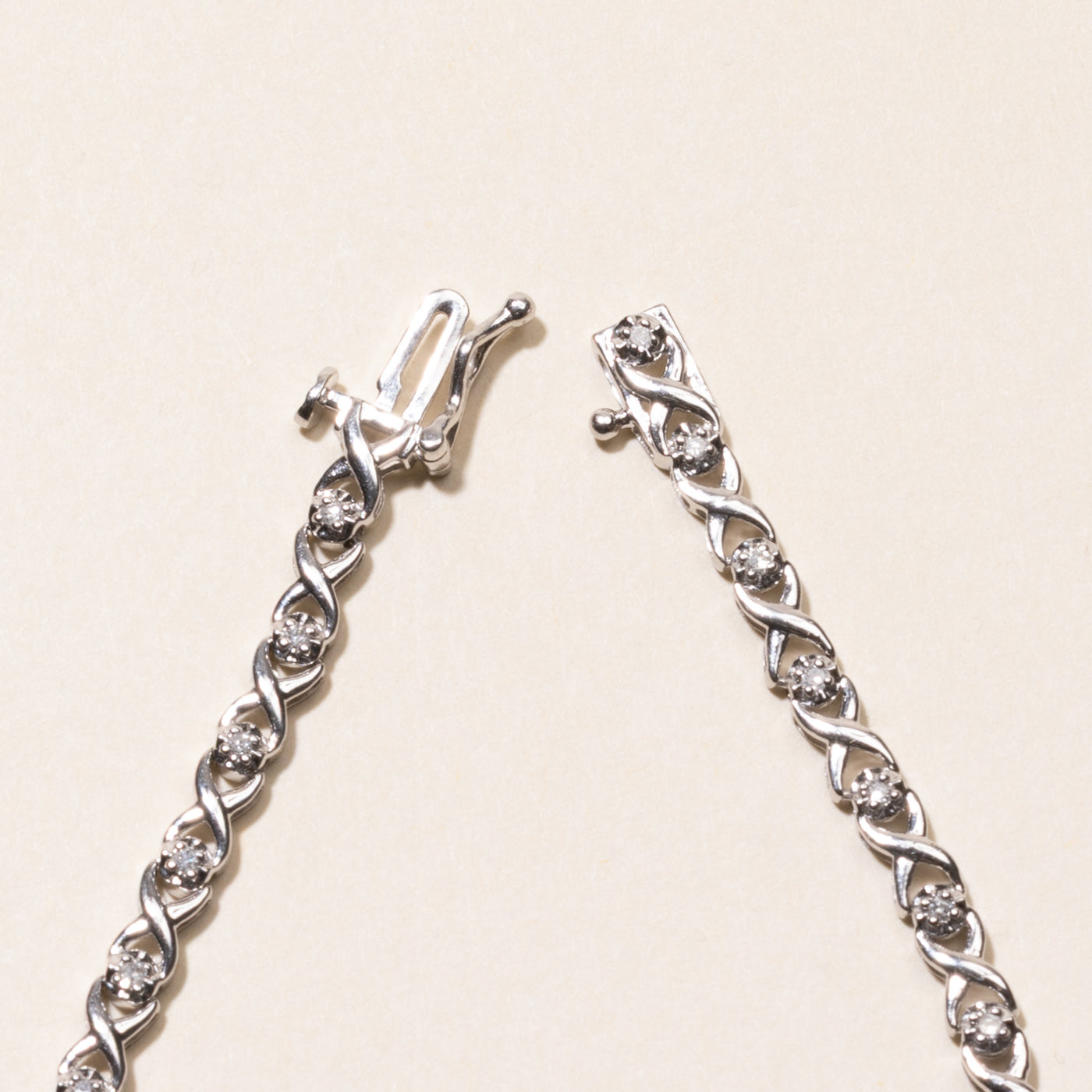 White Gold Illusion Set Diamond X Tennis Bracelet | 0.25ctw | 7.25"