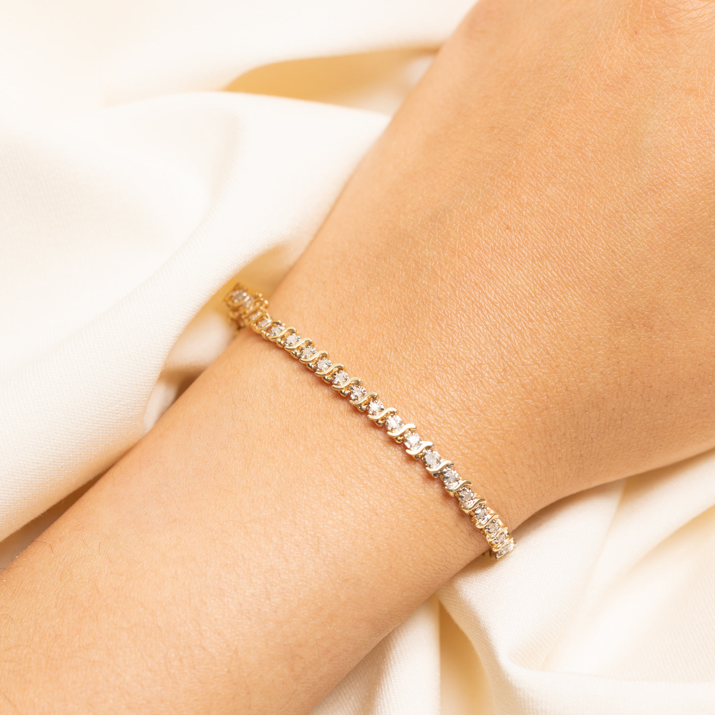 Yellow Gold Illusion Set Diamond Wave Tennis Bracelet | 0.69ctw | 7.5"