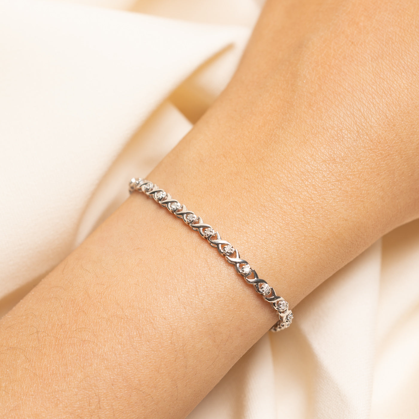 White Gold Illusion Set Diamond X Tennis Bracelet | 0.25ctw | 7.25"