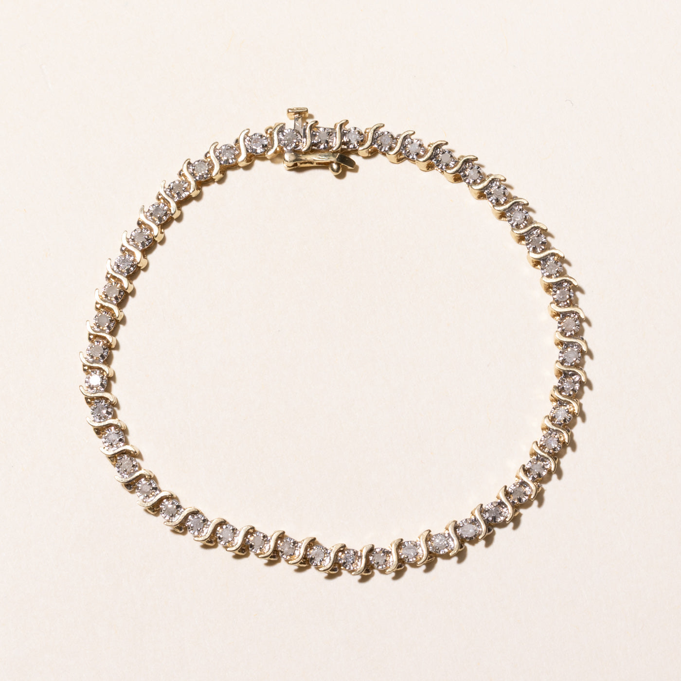 Yellow Gold Illusion Set Diamond Wave Tennis Bracelet | 0.69ctw | 7.5"