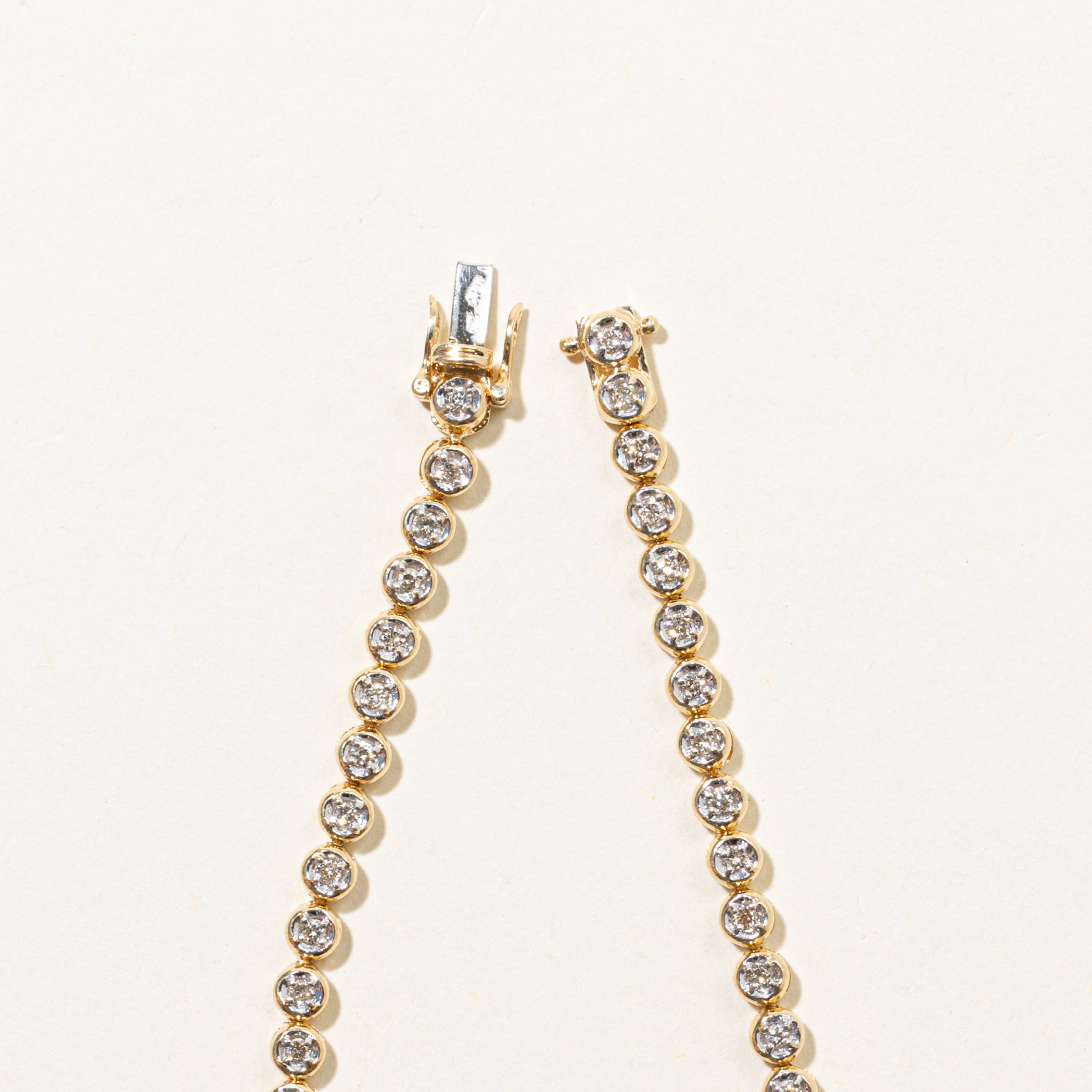 Yellow Gold Illusion Set Diamond Tennis Bracelet | 0.90ctw | 7.5"