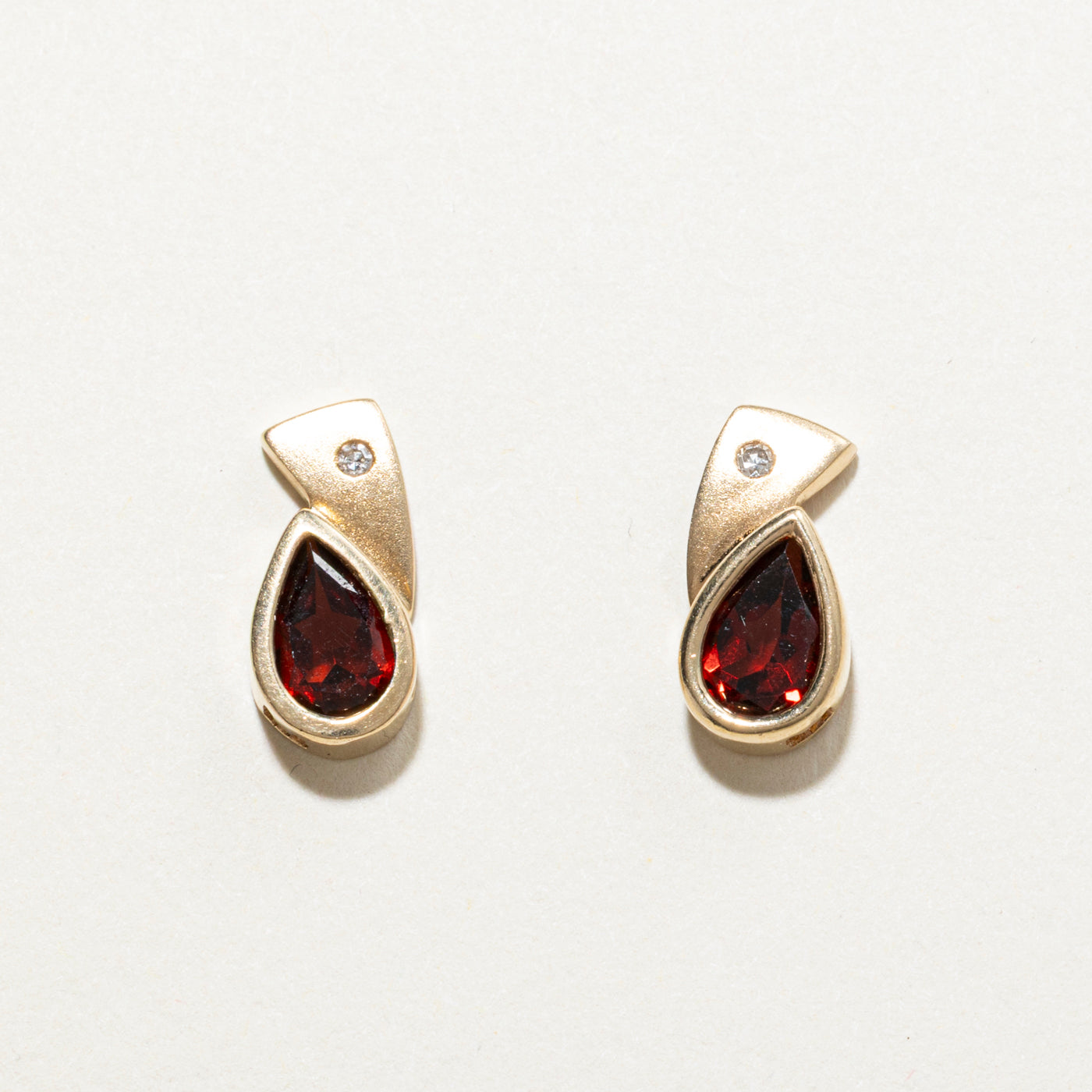 Pear Cut Bezel Set Garnet Stud Earrings | 2.00ctw
