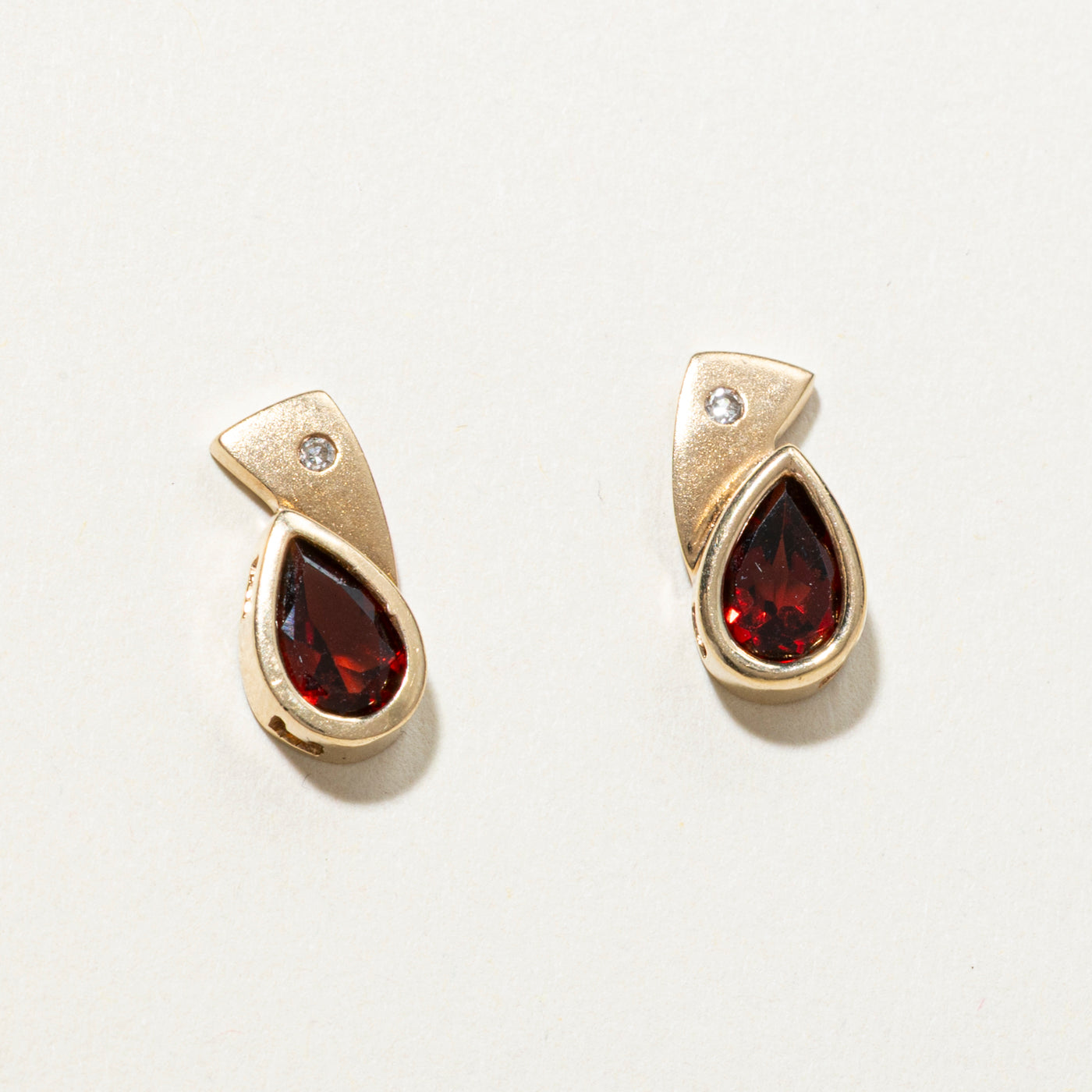 Pear Cut Bezel Set Garnet Stud Earrings | 2.00ctw