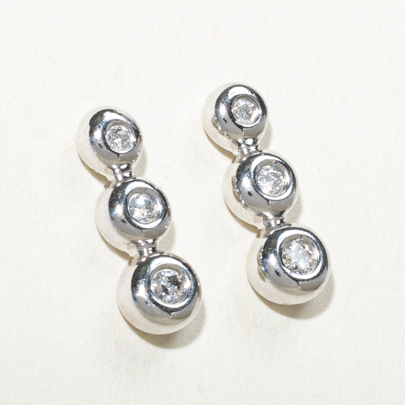 Bezel Set Three Stone Diamond Drop Earrings | 0.14ctw