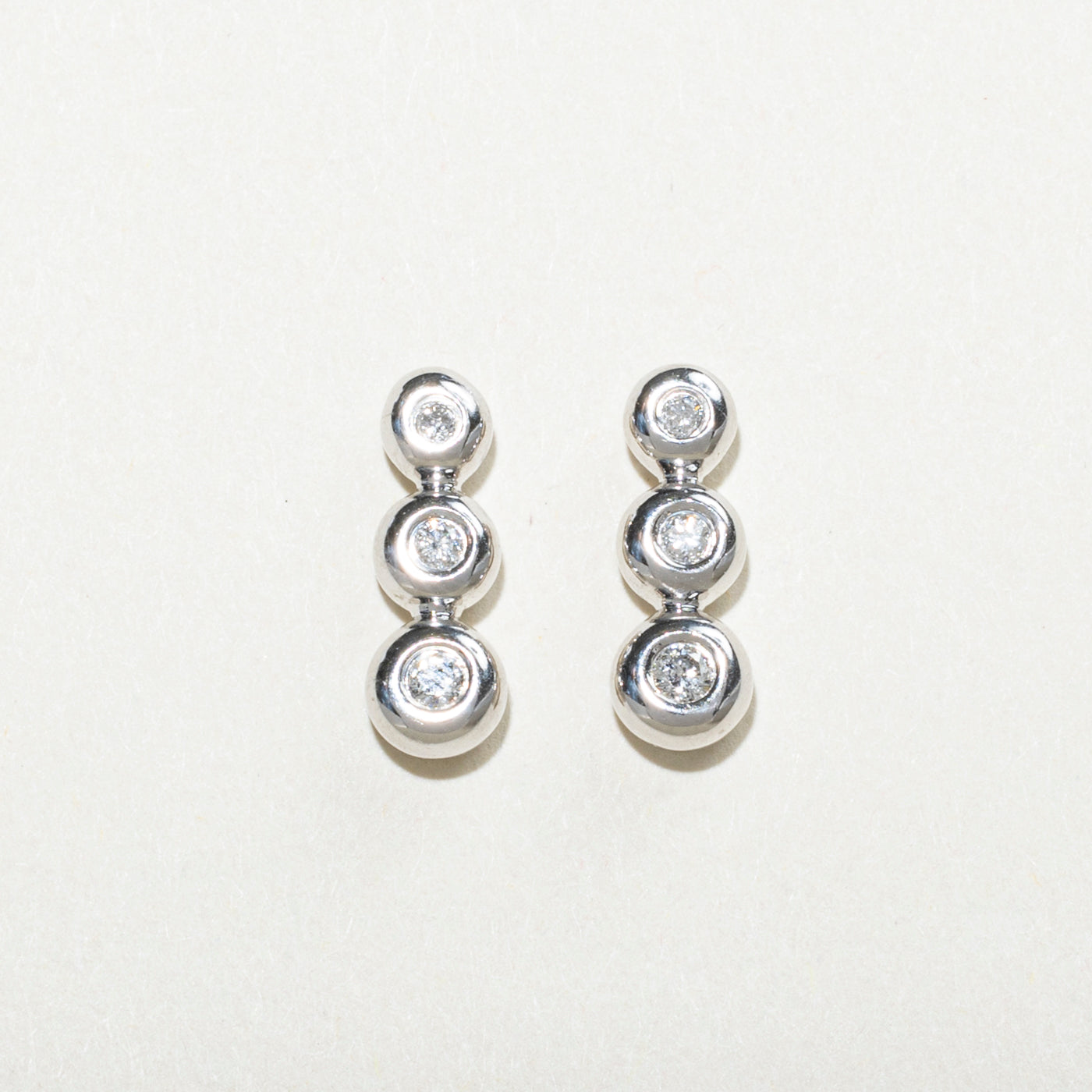 Bezel Set Three Stone Diamond Drop Earrings | 0.14ctw