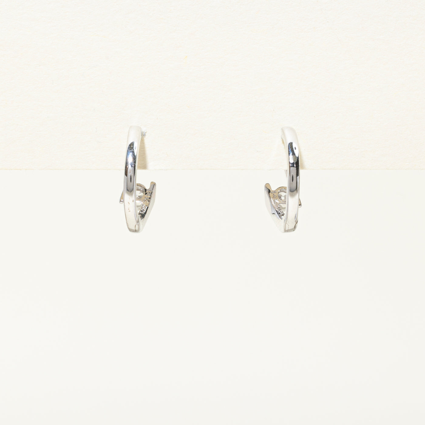 14k Solitaire Diamond Bypass Huggie Earrings | 0.2ctw