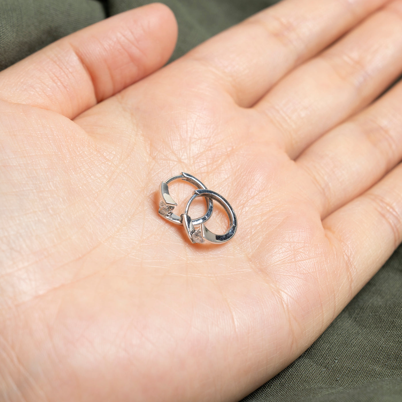 14k Solitaire Diamond Bypass Huggie Earrings | 0.2ctw