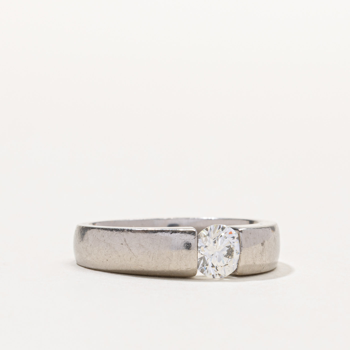 Palladium Round Brilliant Cut Tension Set Diamond Ring | 0.55ct SI1 G/H | SZ 6.5