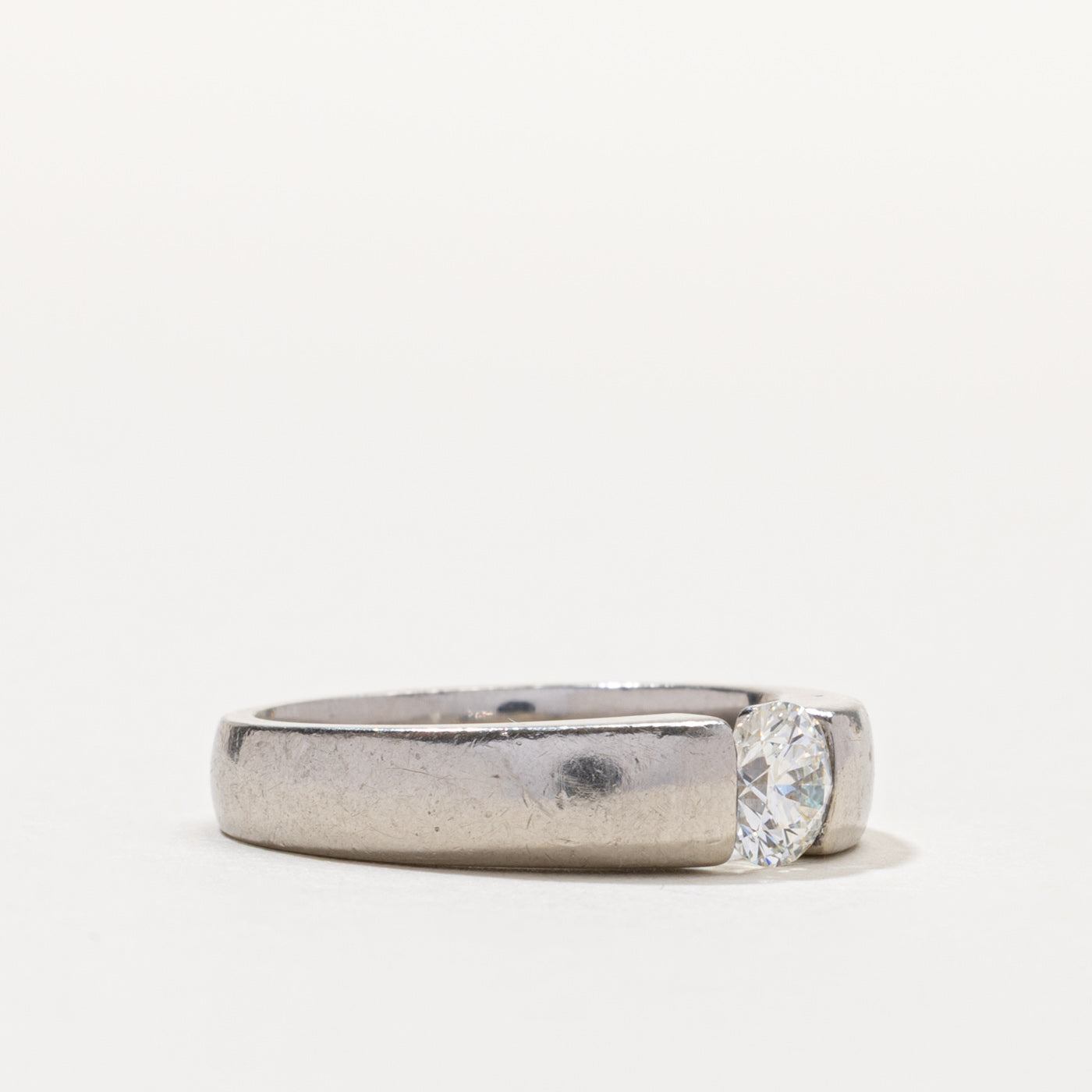 Palladium Round Brilliant Cut Tension Set Diamond Ring | 0.55ct SI1 G/H | SZ 6.5