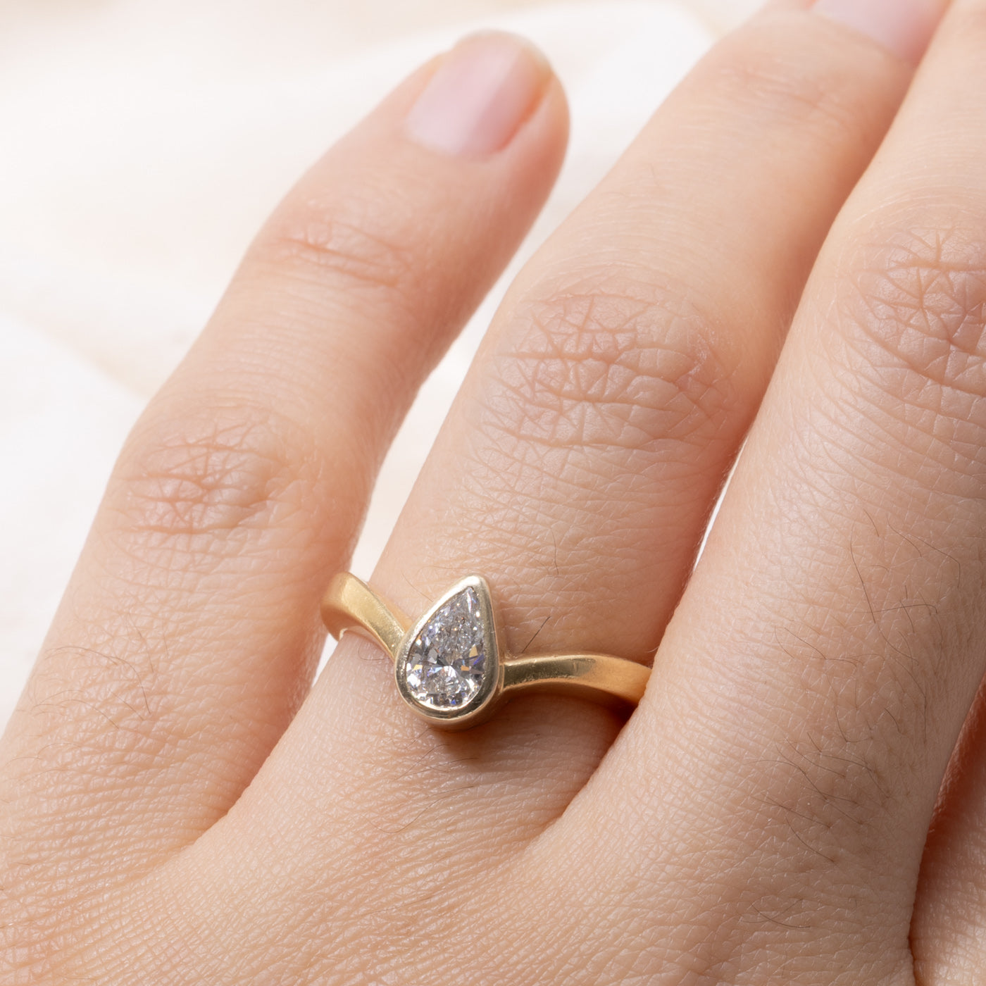 18k Pear Cut Bezel Set Diamond Curved Ring | 0.60ct VS2 G/H | SZ 6