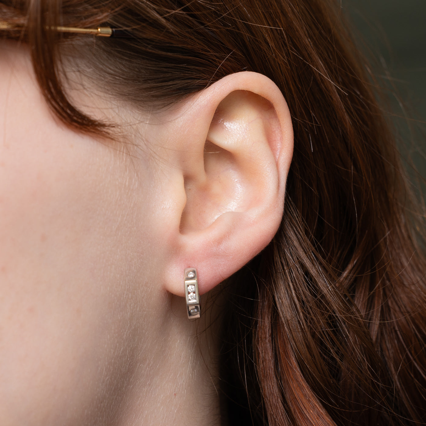 14k Channel Set Diamond Huggie Earrings | 0.12ctw