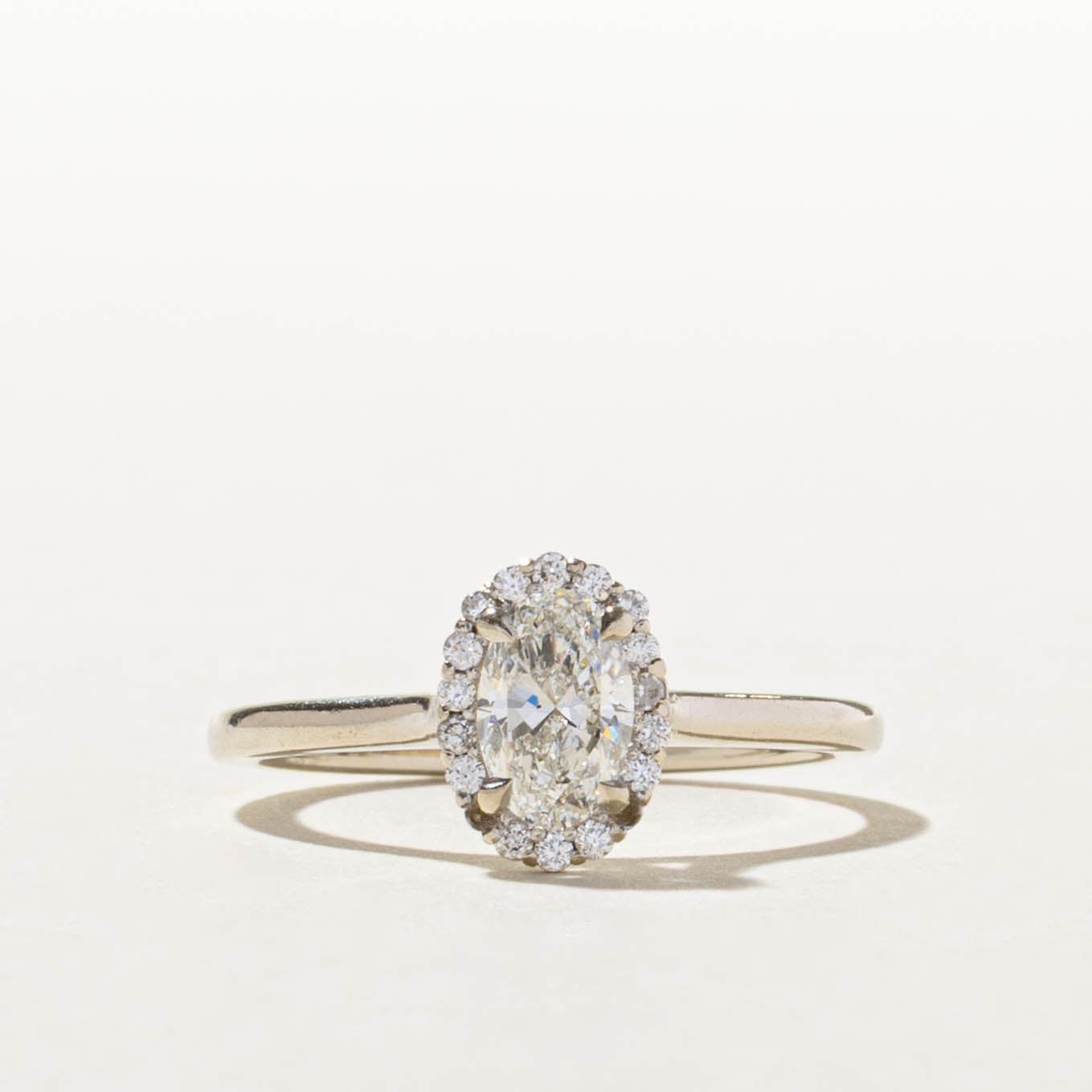 14k GIA Oval Cut Diamond Halo Ring | GIA 0.70ct SI1 H, 0.14ctw | SZ 8