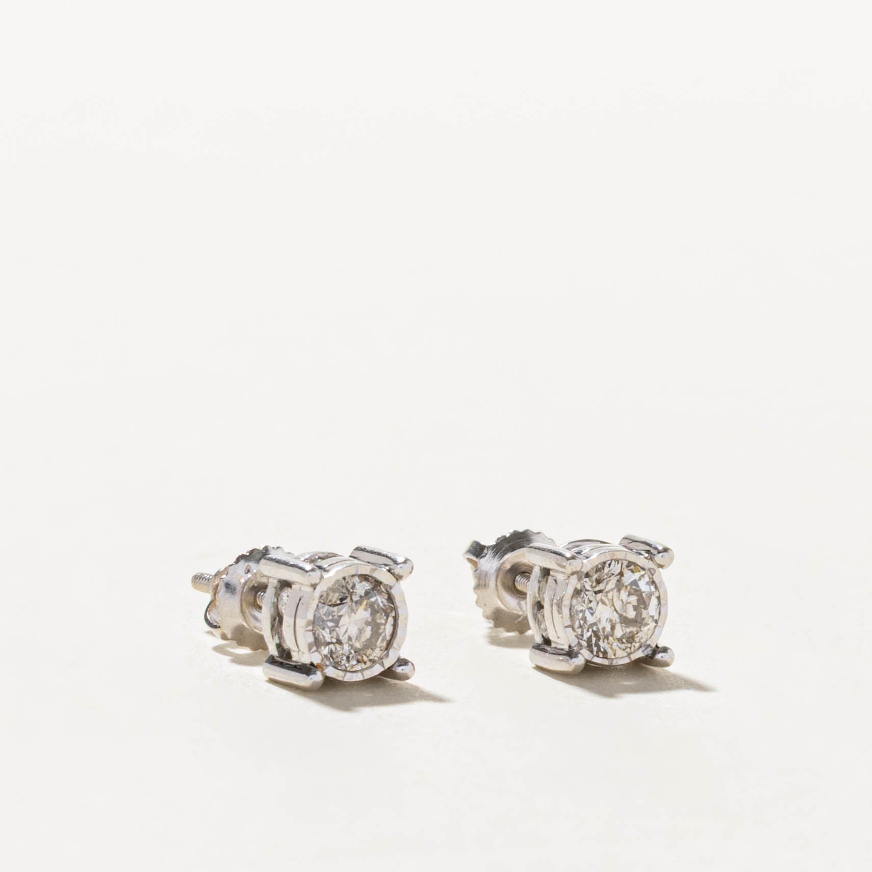 14k Illusion Set & Hidden Diamond Stud Earrings | 0.60ctw