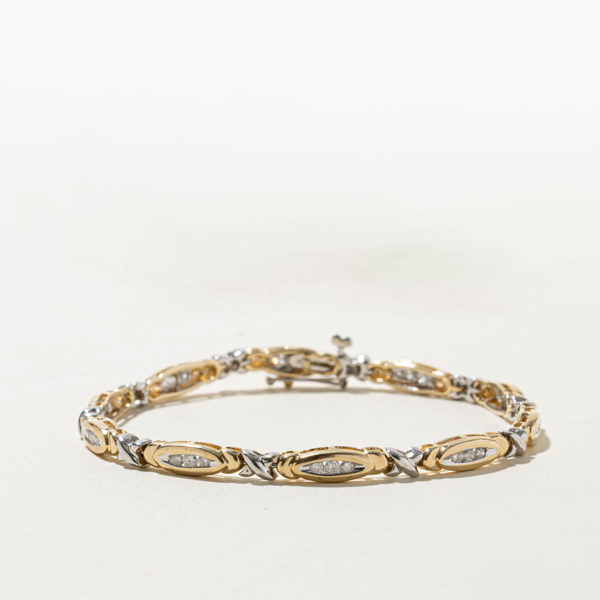 14k Two Tone Channel Set Diamond X Tennis Bracelet | 0.75ctw | 7.5"