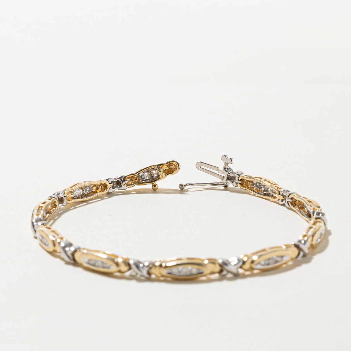 14k Two Tone Channel Set Diamond X Tennis Bracelet | 0.75ctw | 7.5"