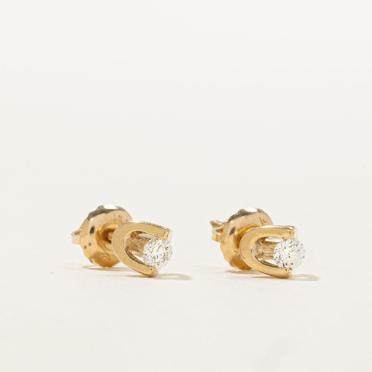 14k Tension Set Diamond Stud Earrings | 0.14ctw