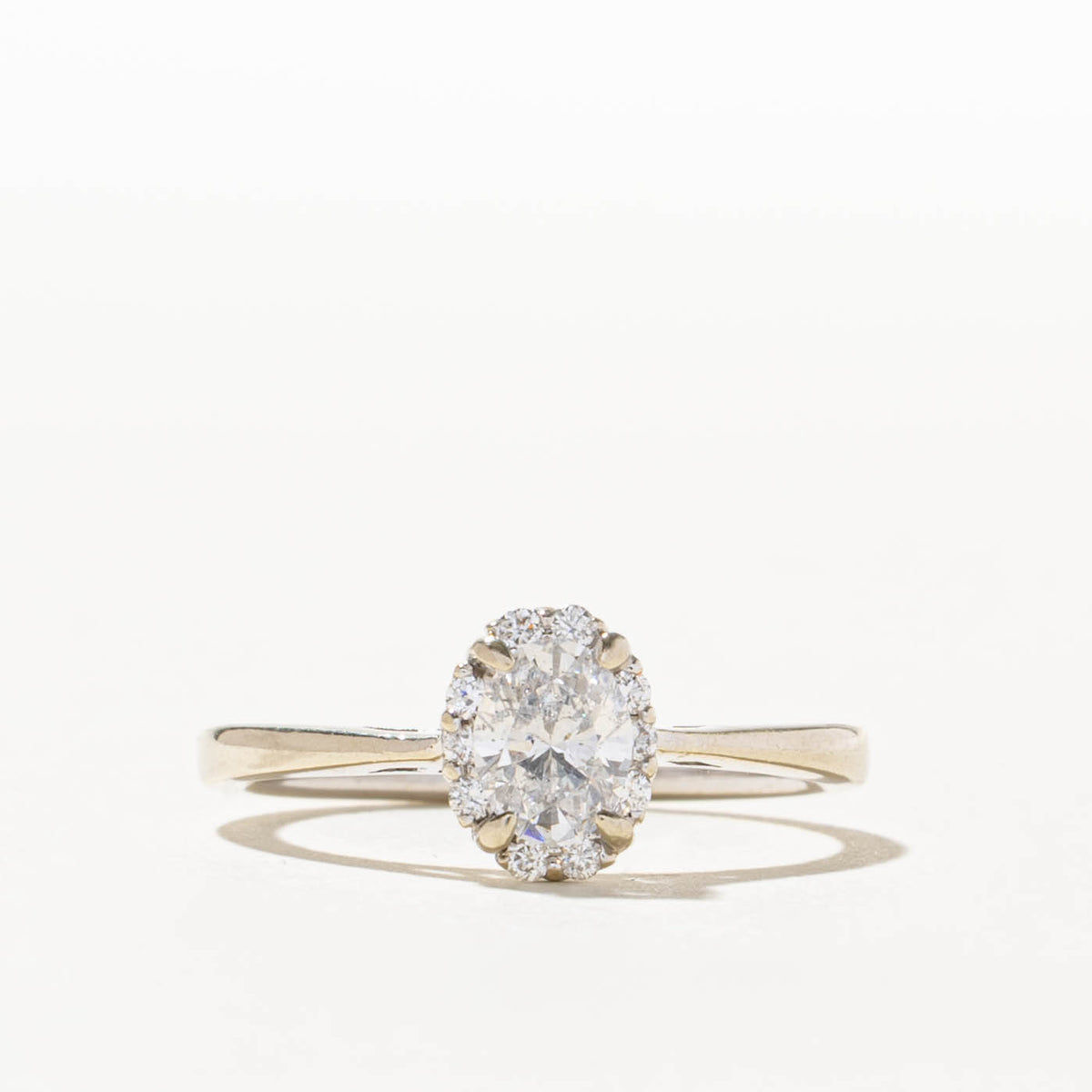 14k Oval Cut Diamond Halo Ring | 0.55ct I1 F, 0.1ctw | SZ 7