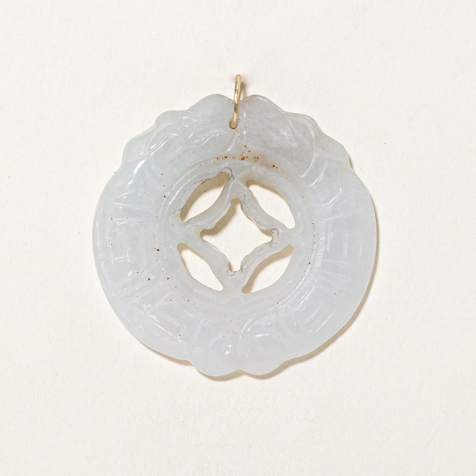 Carved Circular Jadeite Pendant | 43.00ct