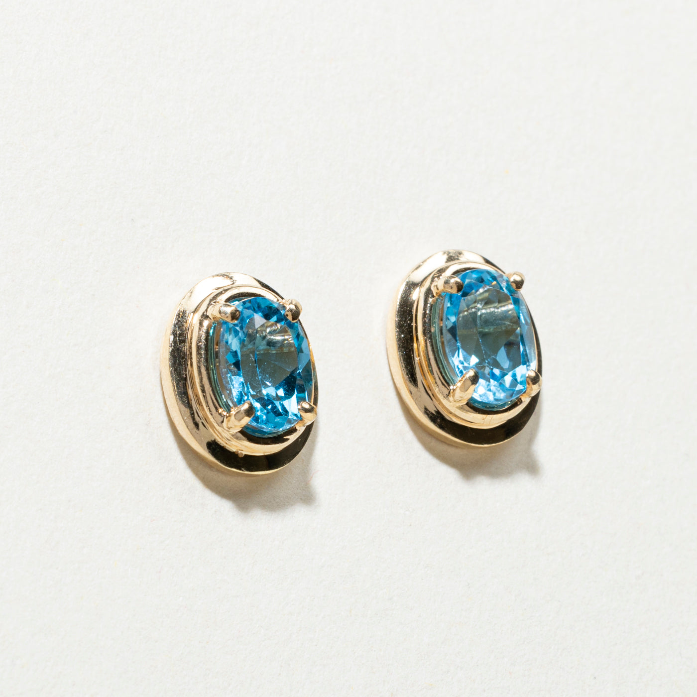 14K Oval Cut Blue Topaz Stud Earrings | 1.50ctw