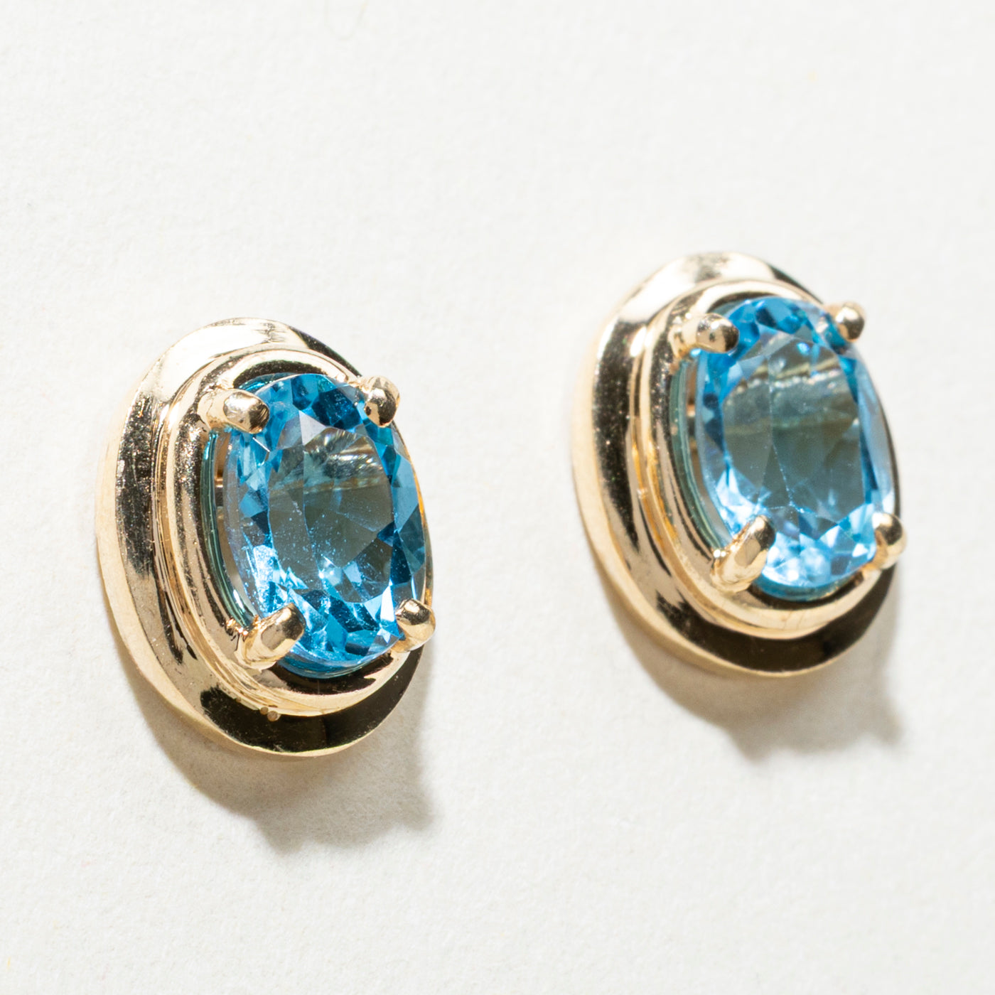 14K Oval Cut Blue Topaz Stud Earrings | 1.50ctw