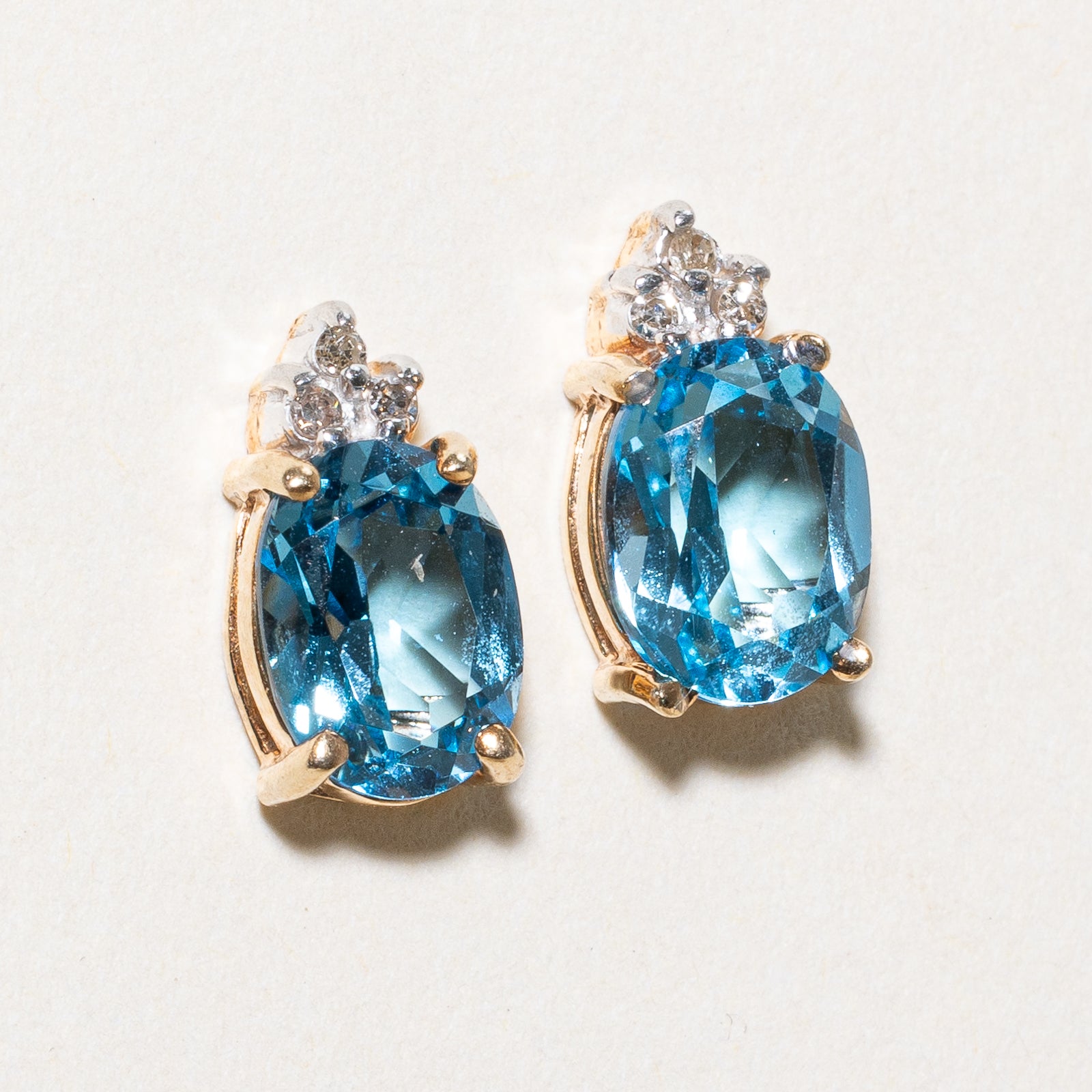 Oval Cut Blue Topaz & Diamond Stud Earrings | 3.00ctw, 0.03ctw |