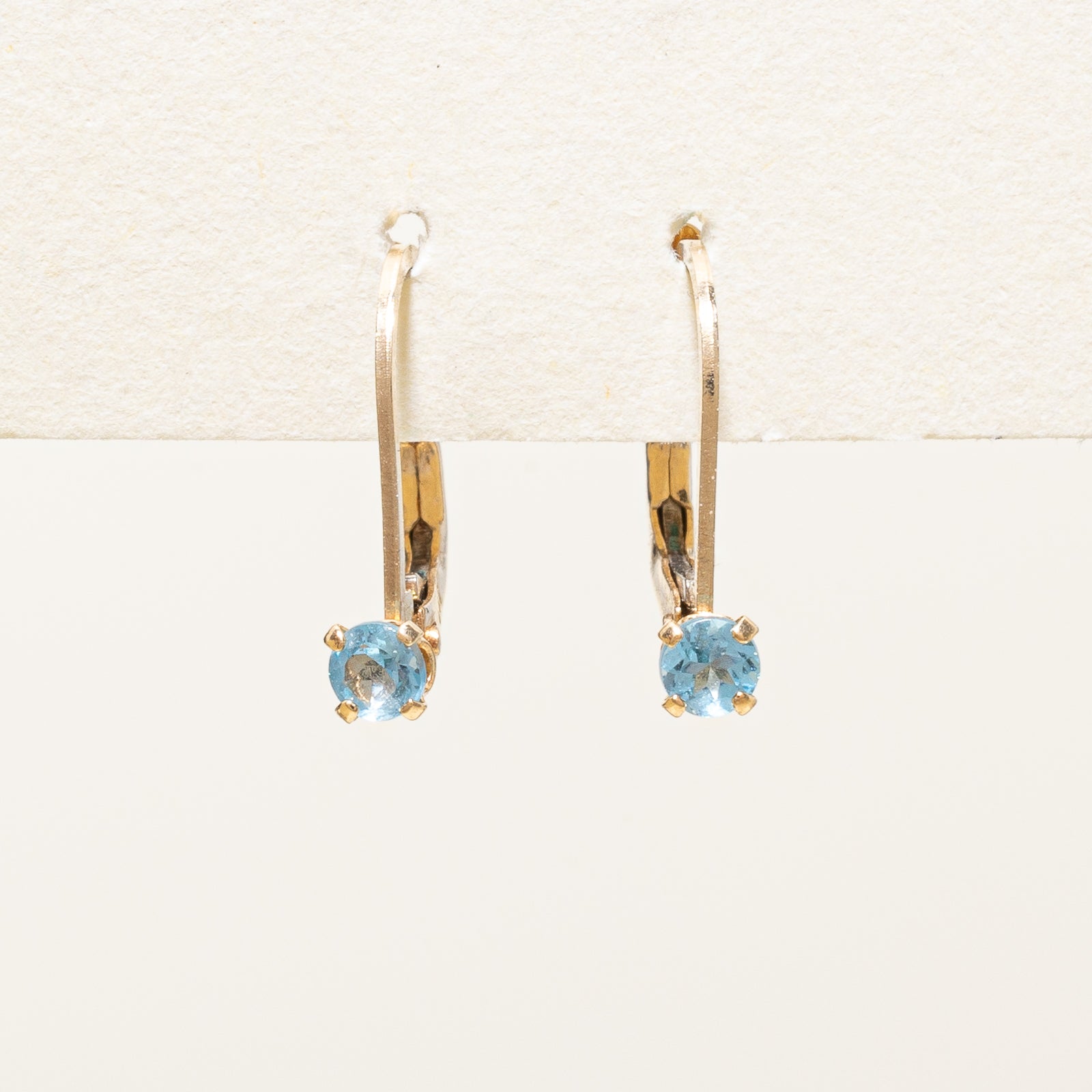 Boucles d'oreilles solitaire en topaze bleue | 0,10 ct