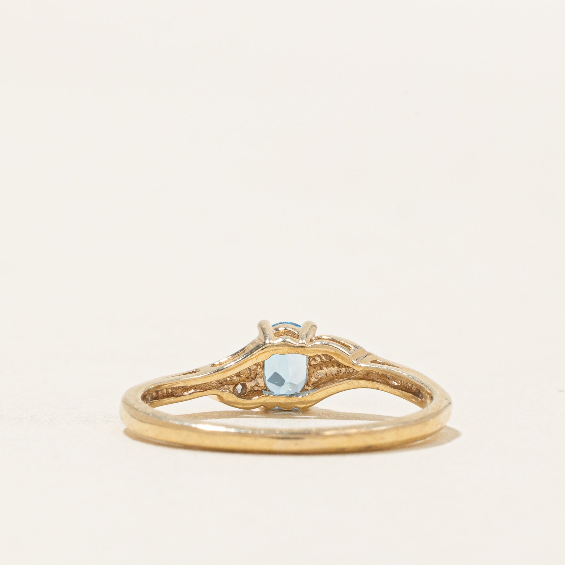 Oval Cut Blue Topaz & Diamond Accented Bypass Ring | 0.22ct, 0.01ctw | SZ 4.75