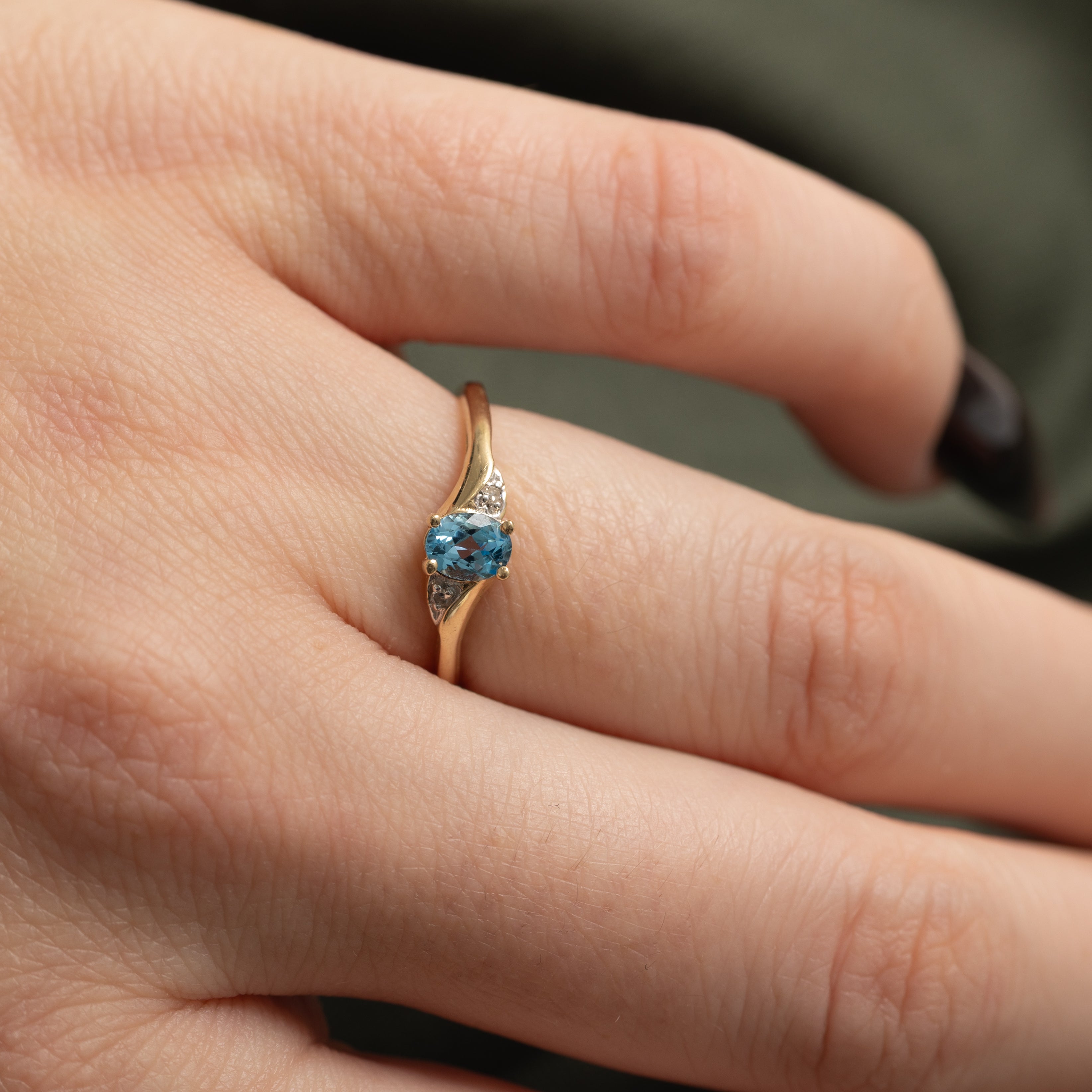 Oval Cut Blue Topaz & Diamond Accented Bypass Ring | 0.22ct, 0.01ctw | SZ 4.75