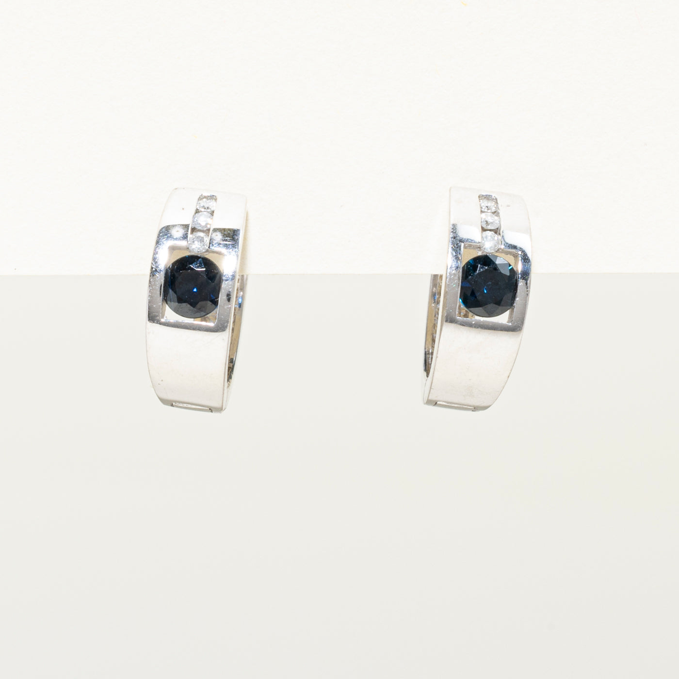 10k White Gold Sapphire & Diamond Huggie Earrings | 0.64ctw, 0.08ct